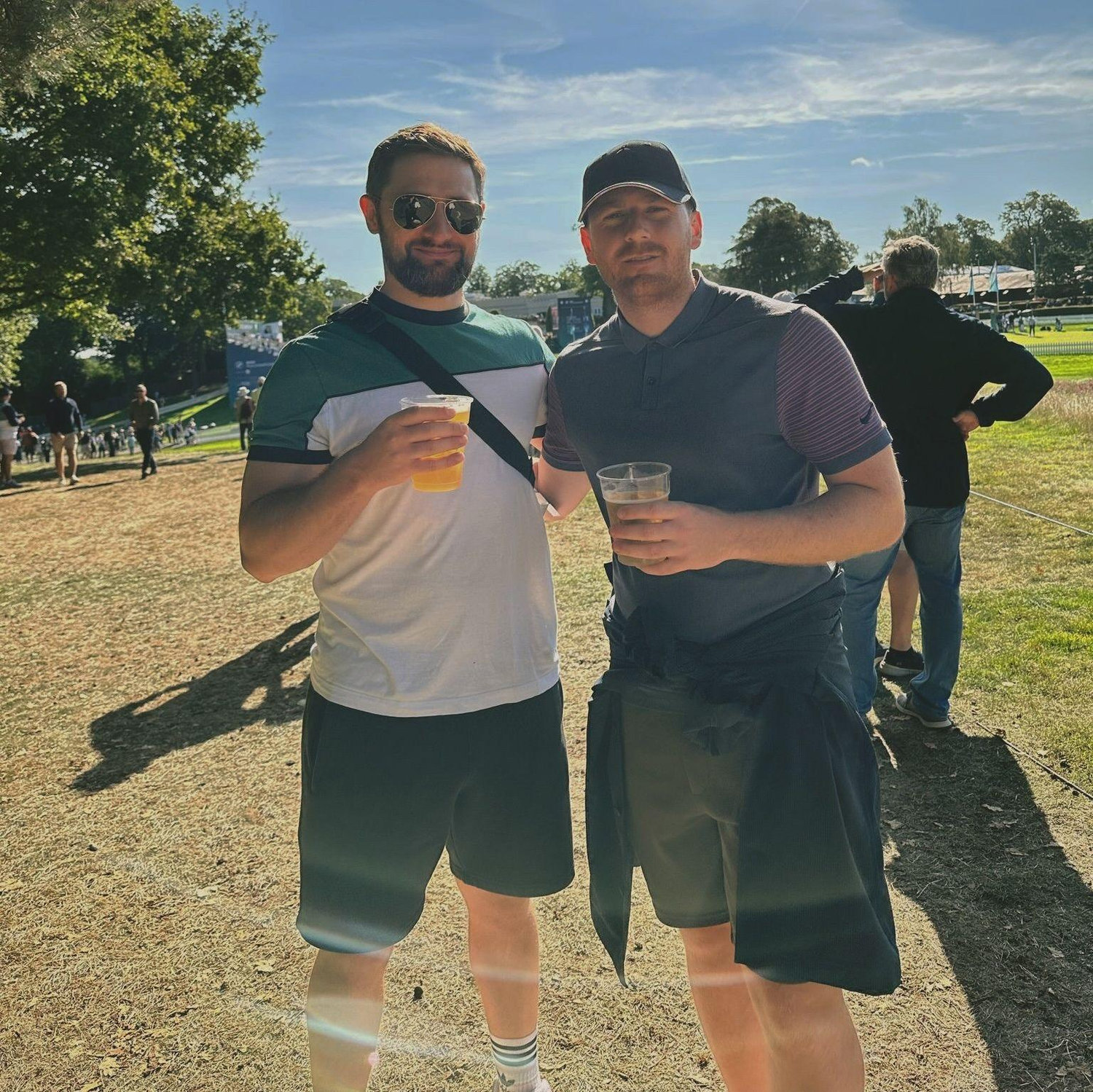 Nick & Jake having a Diet Coke at the golf and burning themselves under the sun!!