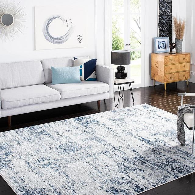 SAFAVIEH Amelia Collection Area Rug - 6' x 9', Ivory & Navy, Modern Abstract Design, Non-Shedding & Easy Care, Ideal for High Traffic Areas in Living Room, Bedroom (ALA700B)