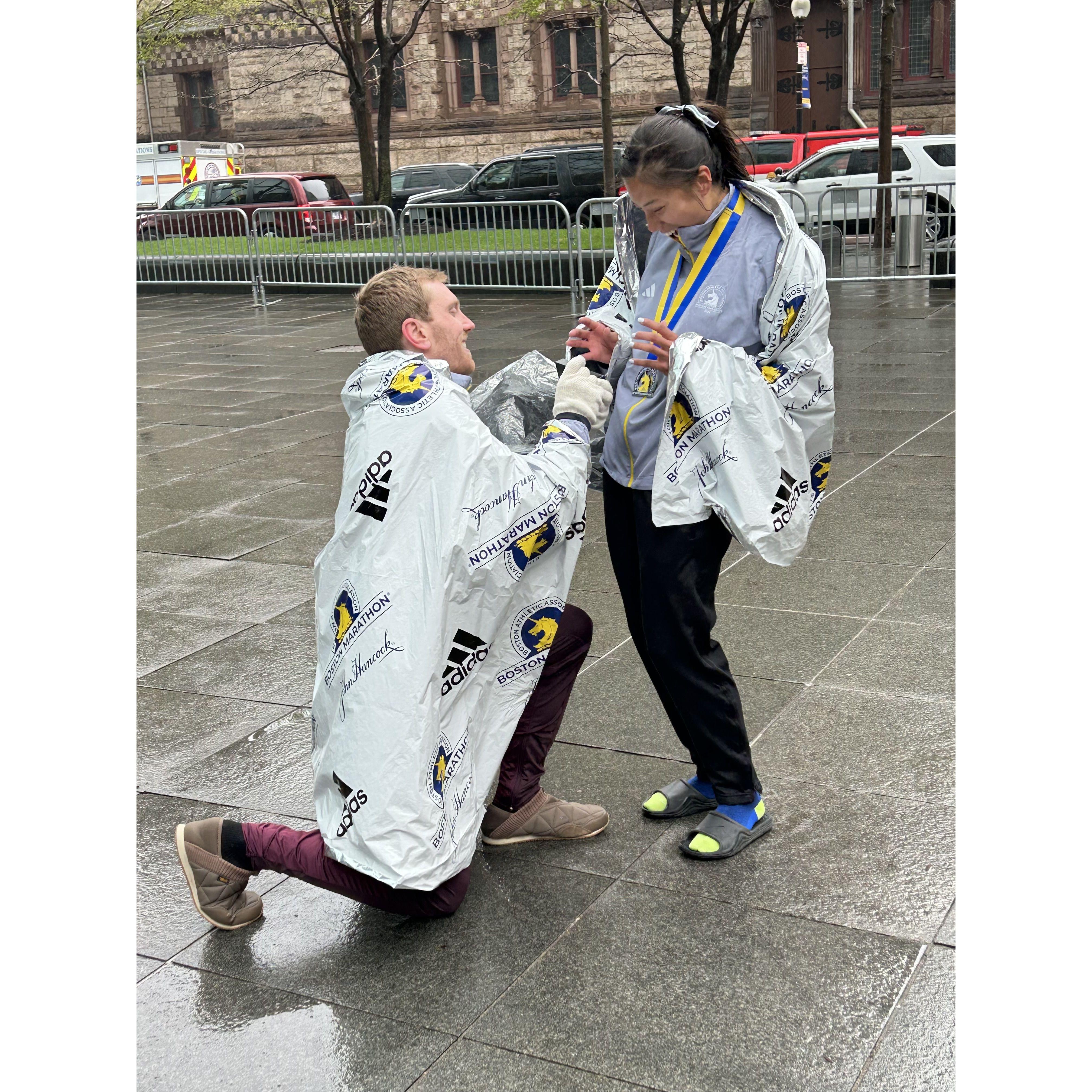 He got on one knee after running a marathon, and she said yes!