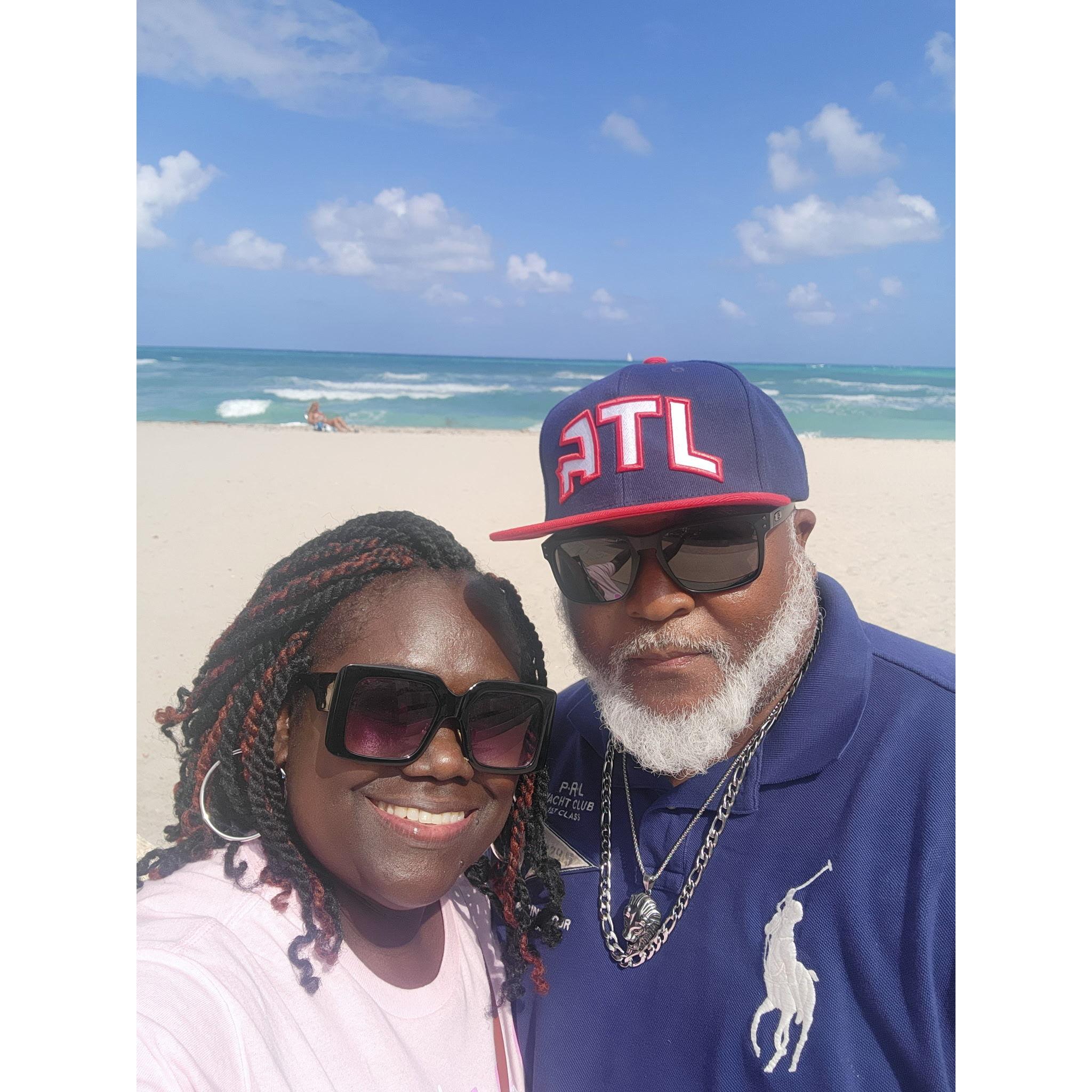 Sun, sand, and each other; Alan and Mamie soaking up love and sunshine on a perfect beach getaway.