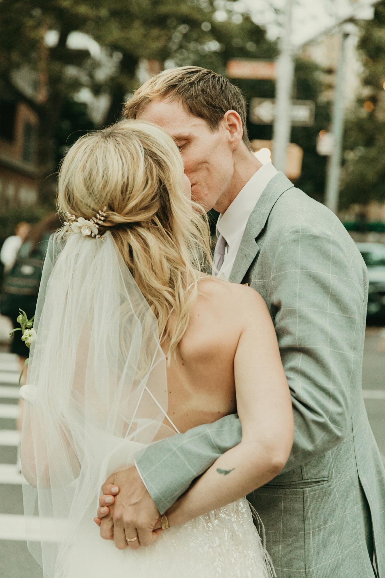 Walking from the ceremony to our ride to the reception, with fresh tan lines from the bachelorette party. Pic by @purroy_photo_video