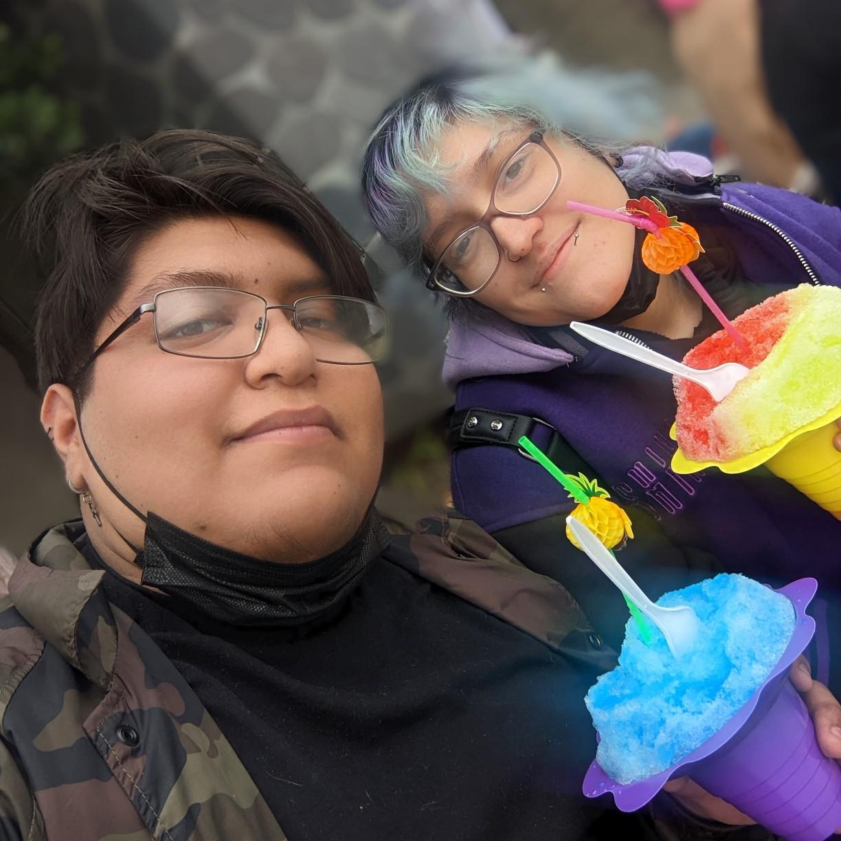 Eating giant shaved ice at a convention.