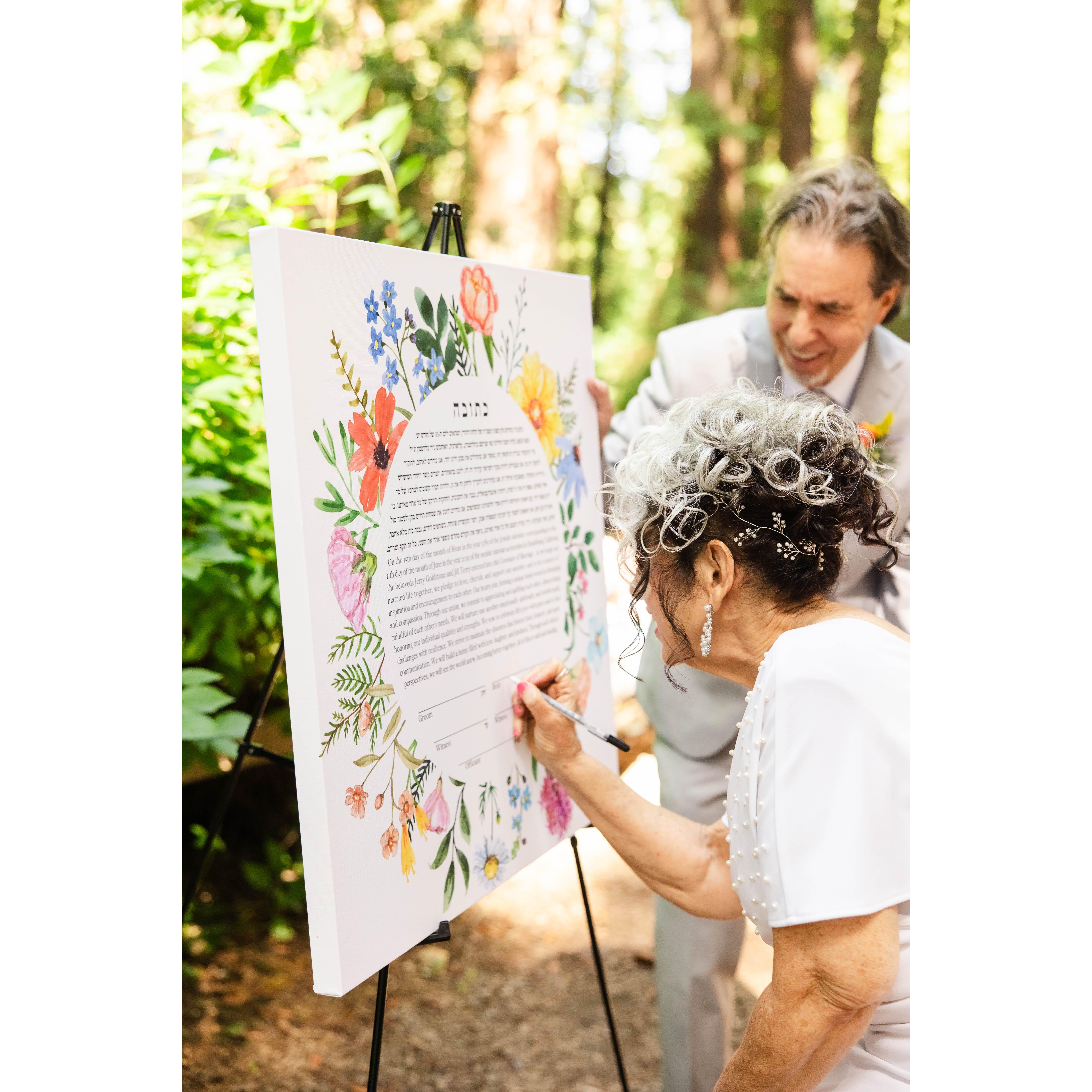 Jill signs the ketubah