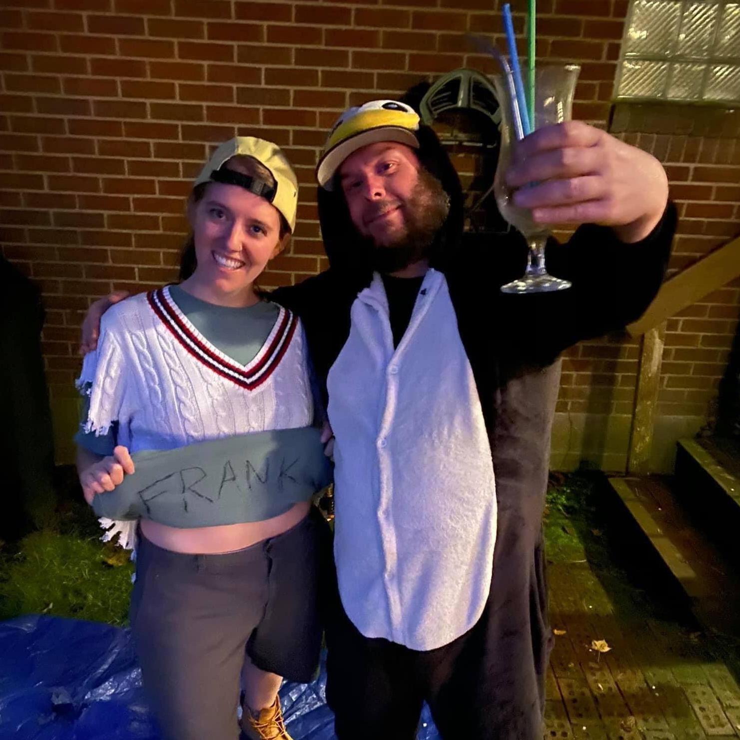 One of our favorite things to do is throw parties. Here we are dressed as Billy Madison and the penguin at our Halloween party in 2019. We can't wait to party with you at our wedding!
