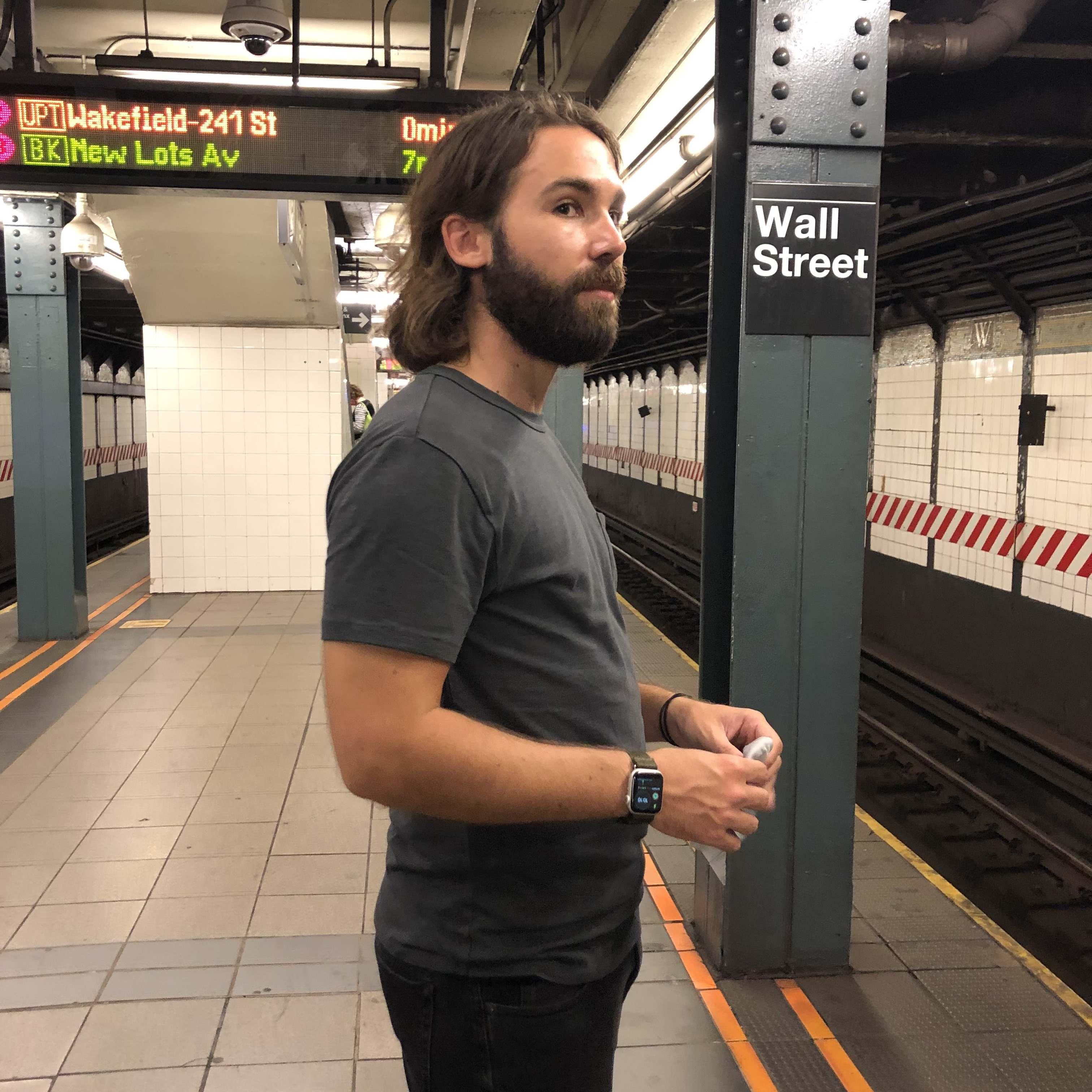Alex waiting for the 1 on Wall St. June 2022