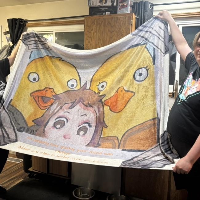 A blanket with a picture Nicky drew.