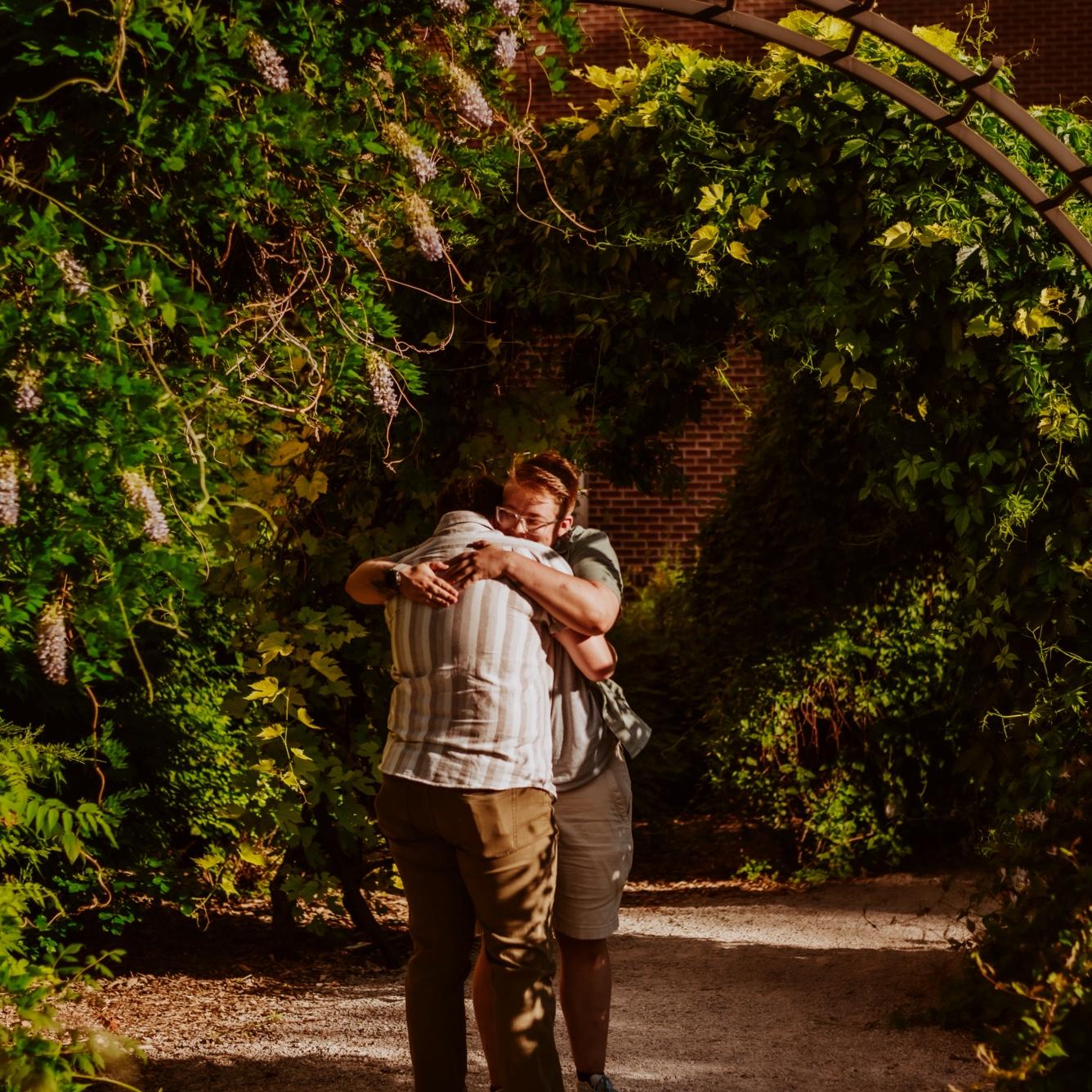 Francis’s favorite flower is wisteria. When he saw the vine growing in full bloom on the arch, he knew this was the perfect place to pop the question!