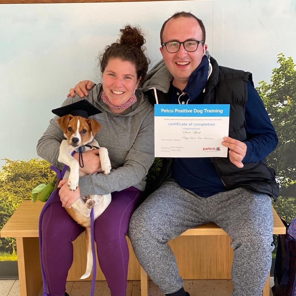 Very proud puppy-parents at Stevie's level one graduation