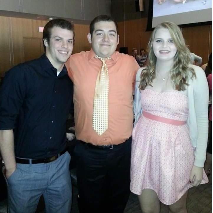 The couple with best friend Michael Gotwald in at a banquet in May 2014.