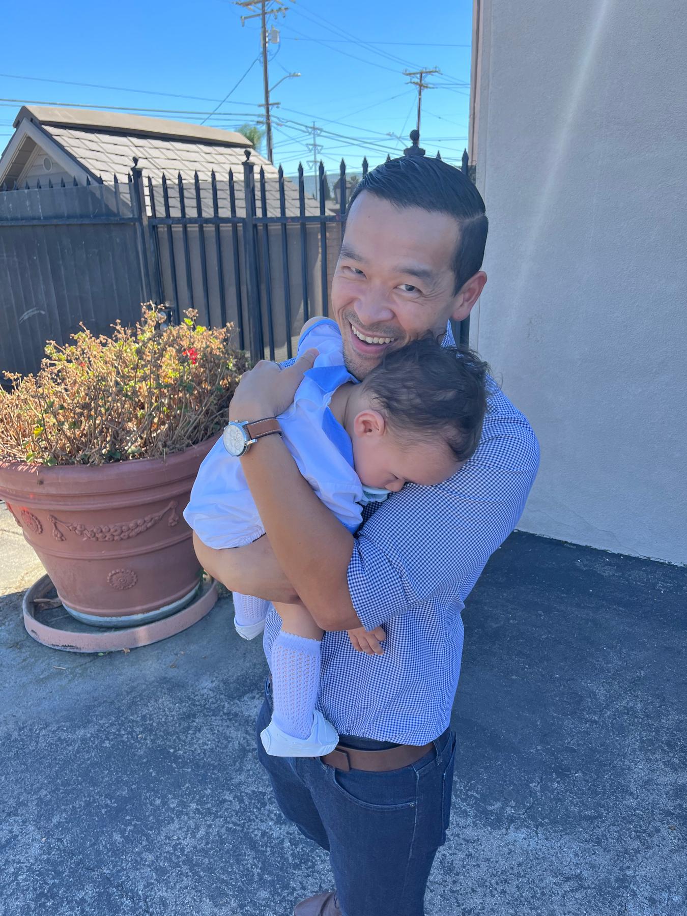 Fri and his nephew Charlie at his baptism.