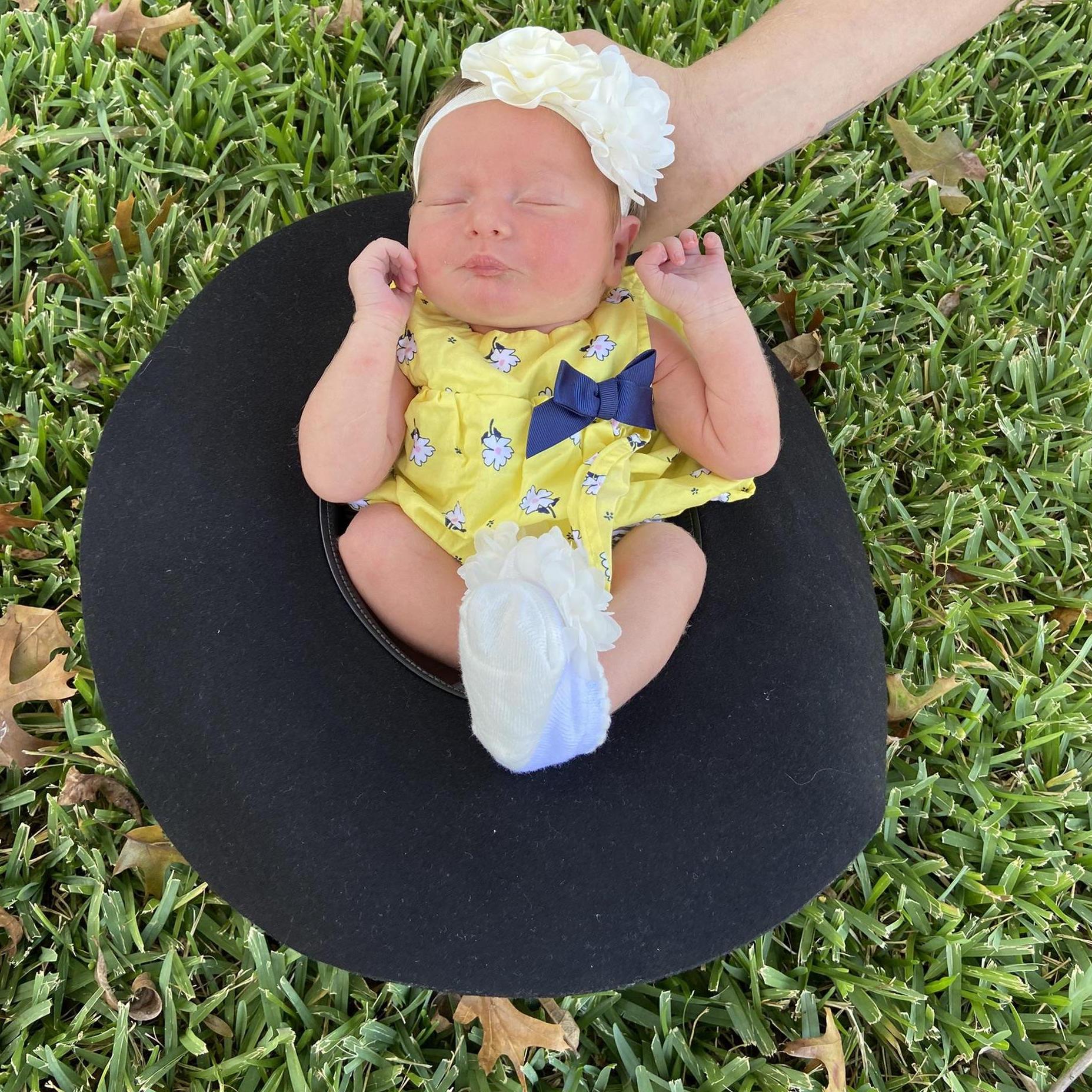 She used to fit in her dad's hat before she got chubby
