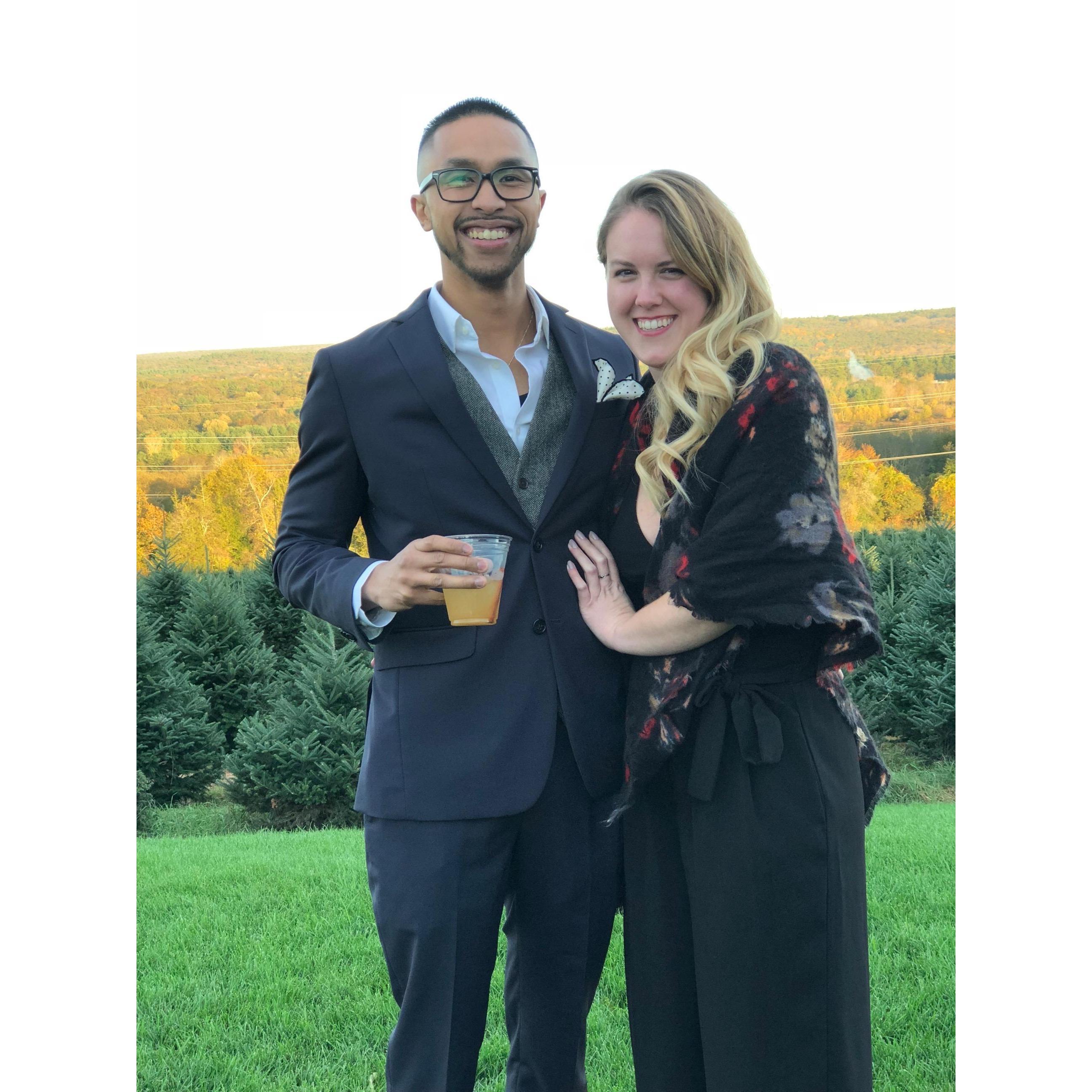Bianca and Drew's wedding in front of the Christmas trees.