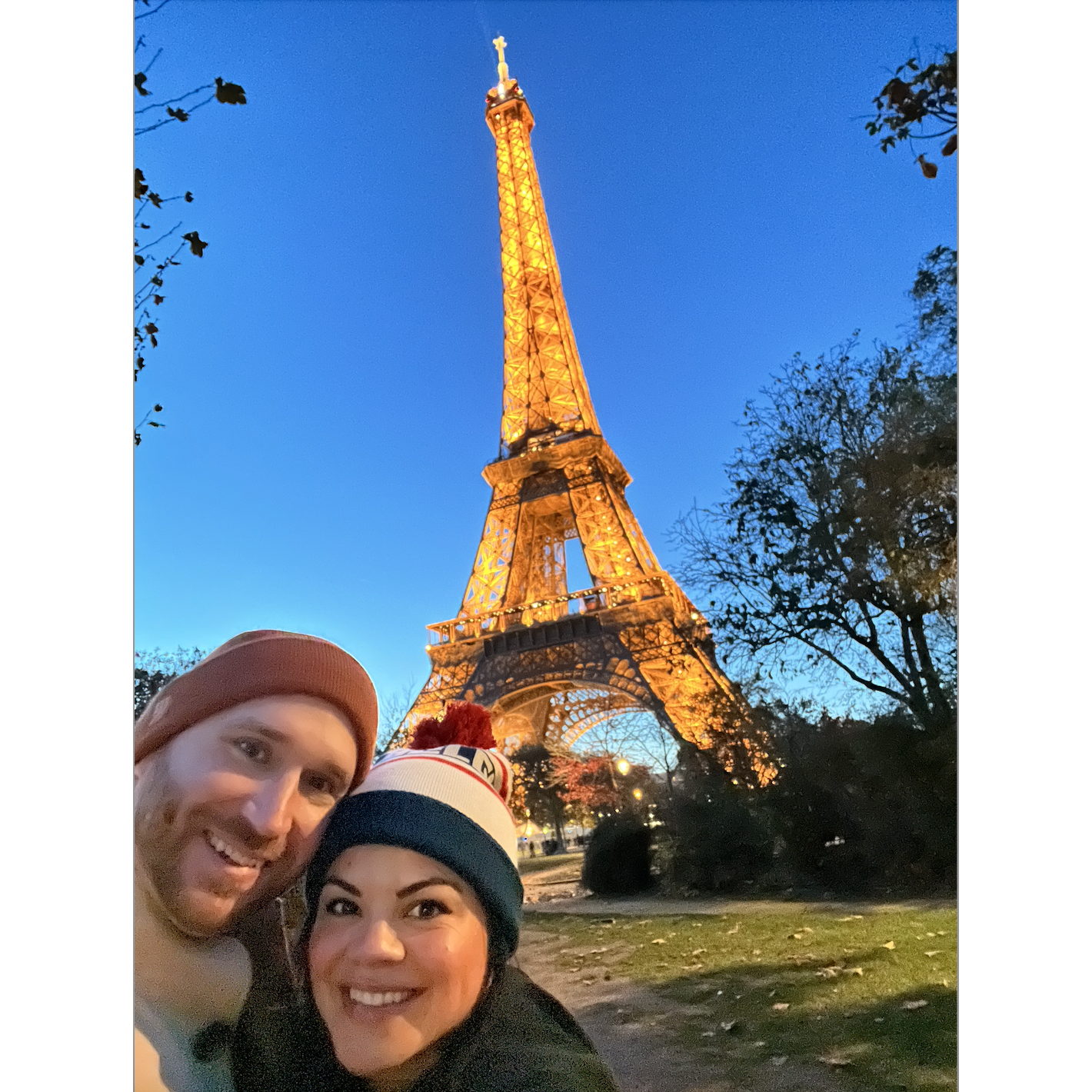 Drinking wine and eating baguettes in the rain by the Eiffel Tower