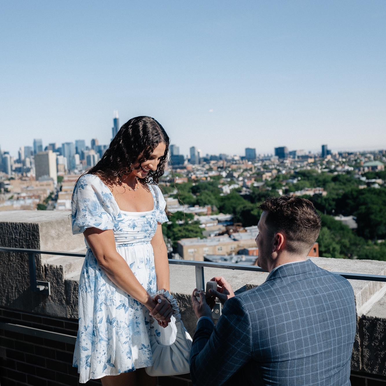 The proposal! Will proposed on top of a rooftop bar overlooking the city on Memorial Day weekend.