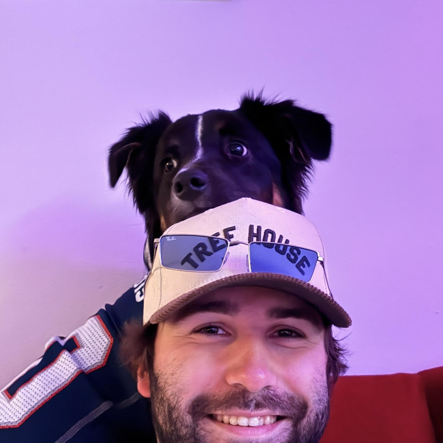 Our Pup Ranger laying on Mikes head.