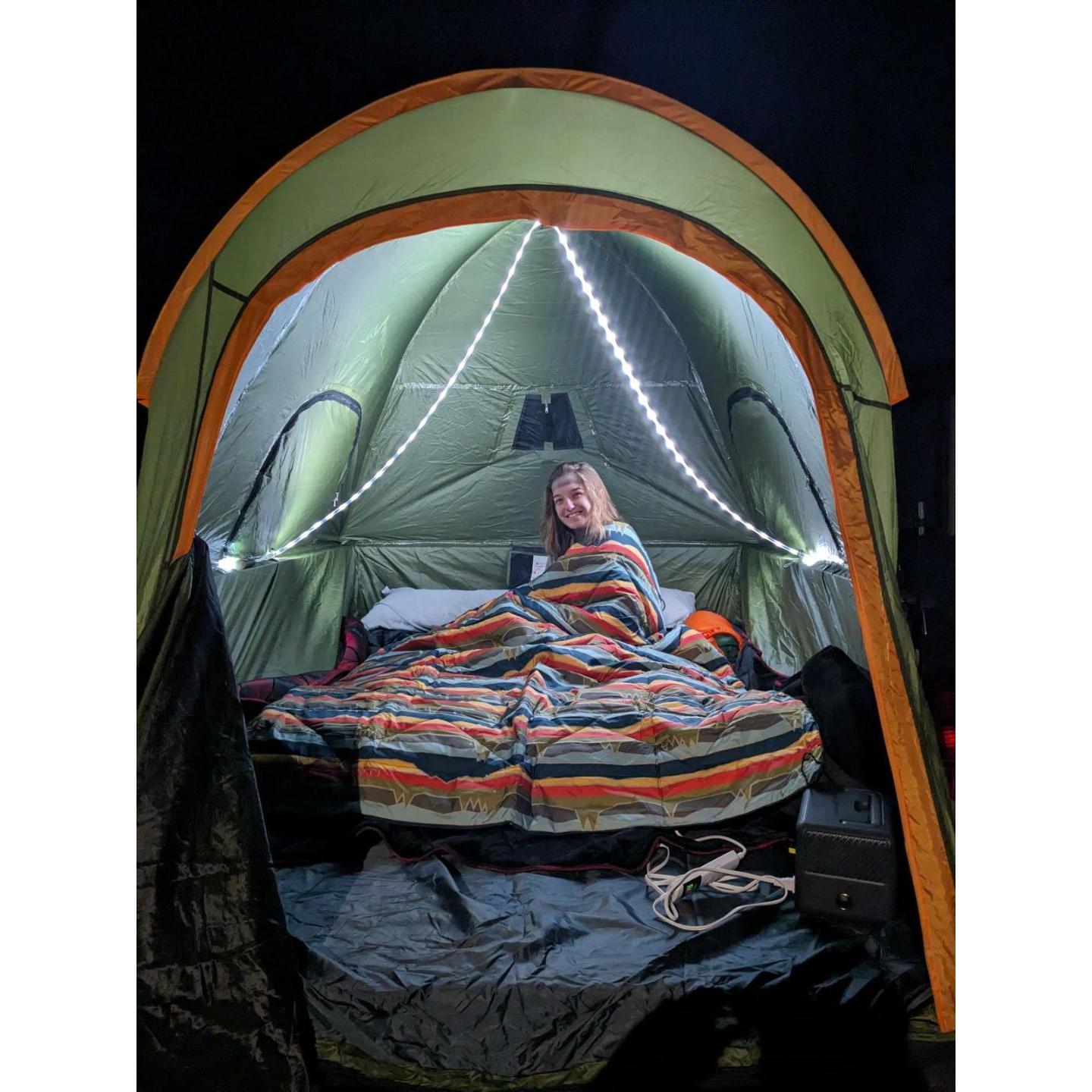 Our magical setup with our string lights, air mattress, and camping blankets.