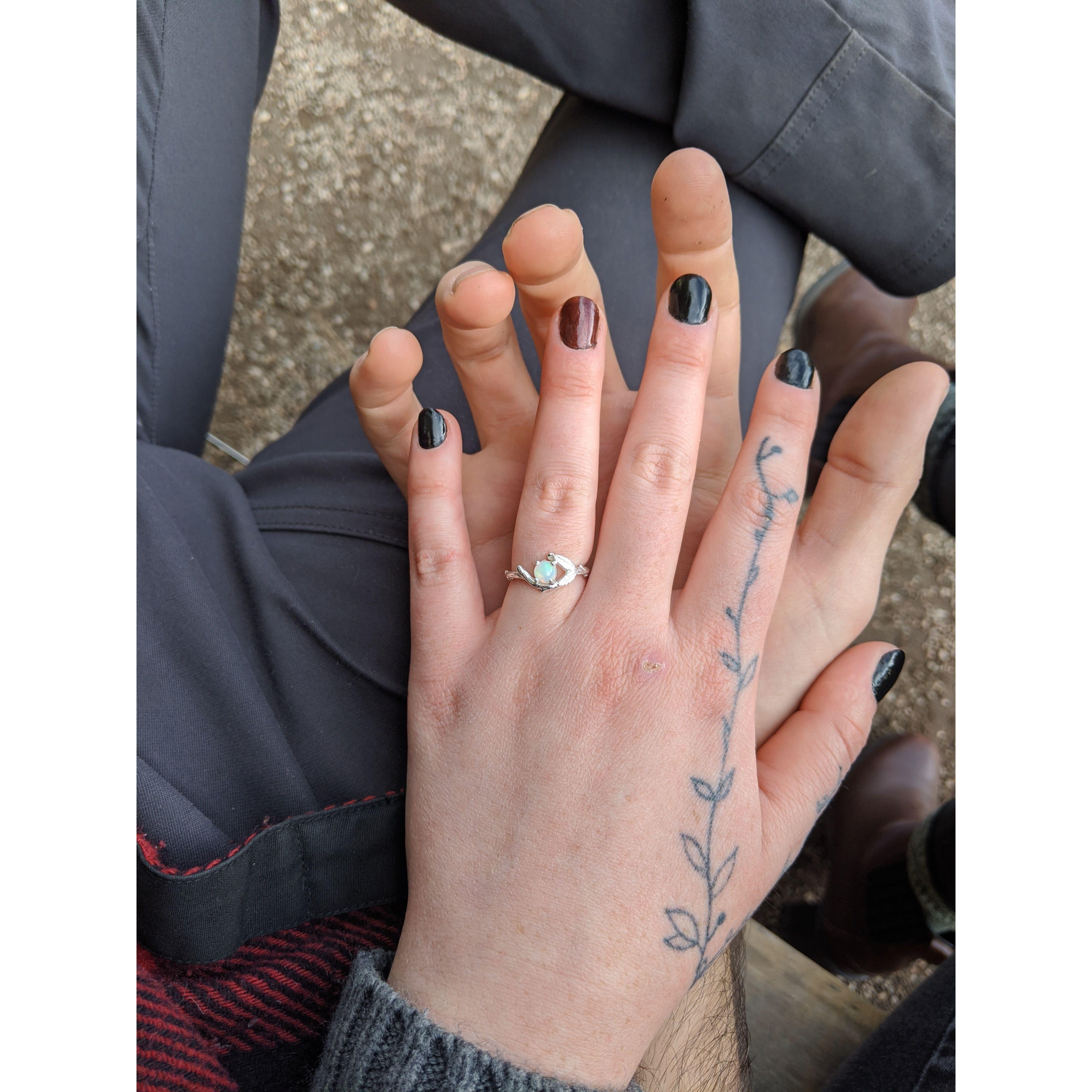 The opal engagement ring was a birthday gift since Kinsey did the initial proposing.