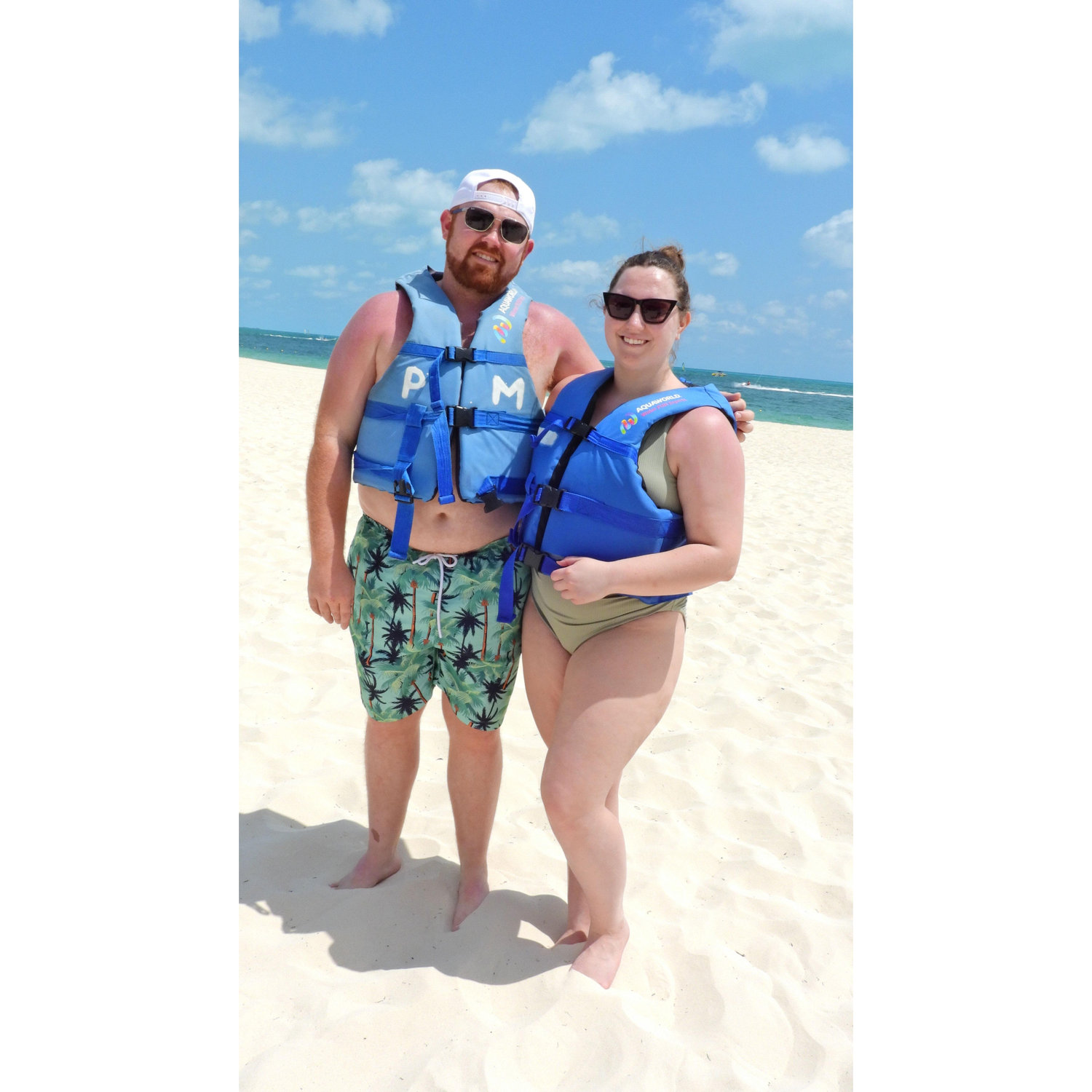 The day after Austin proposed, the two of us swam with dolphins and rode a jet ski. Here's us before!