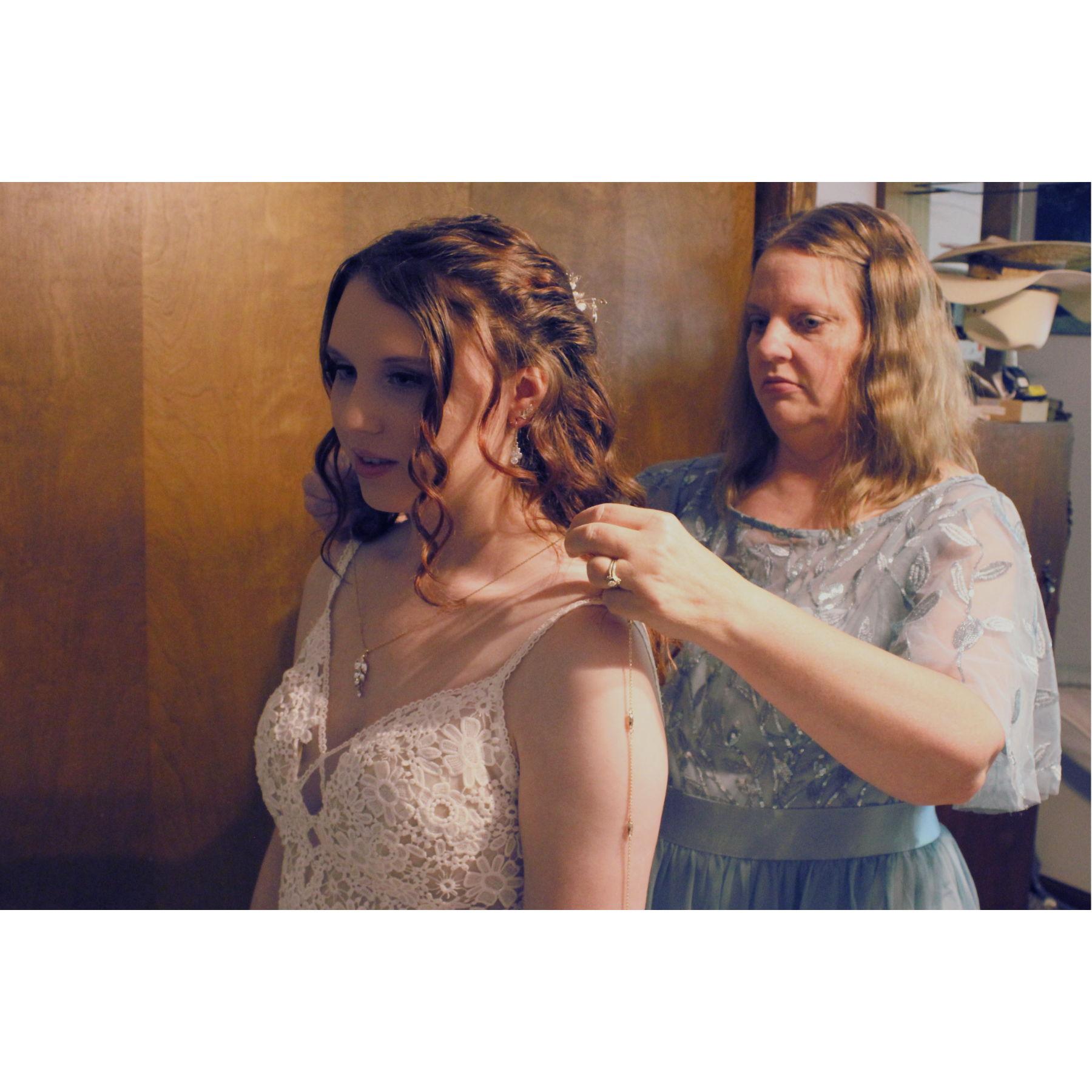 Jennifer putting on Kristina's Necklace