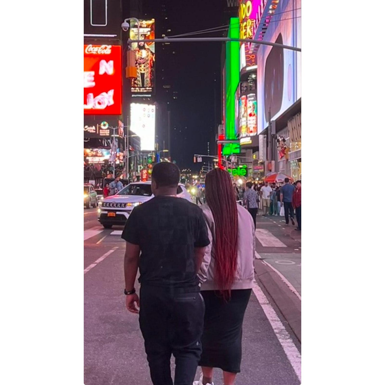 Our friend took this picture of us while we were walking through Times Square in New York.