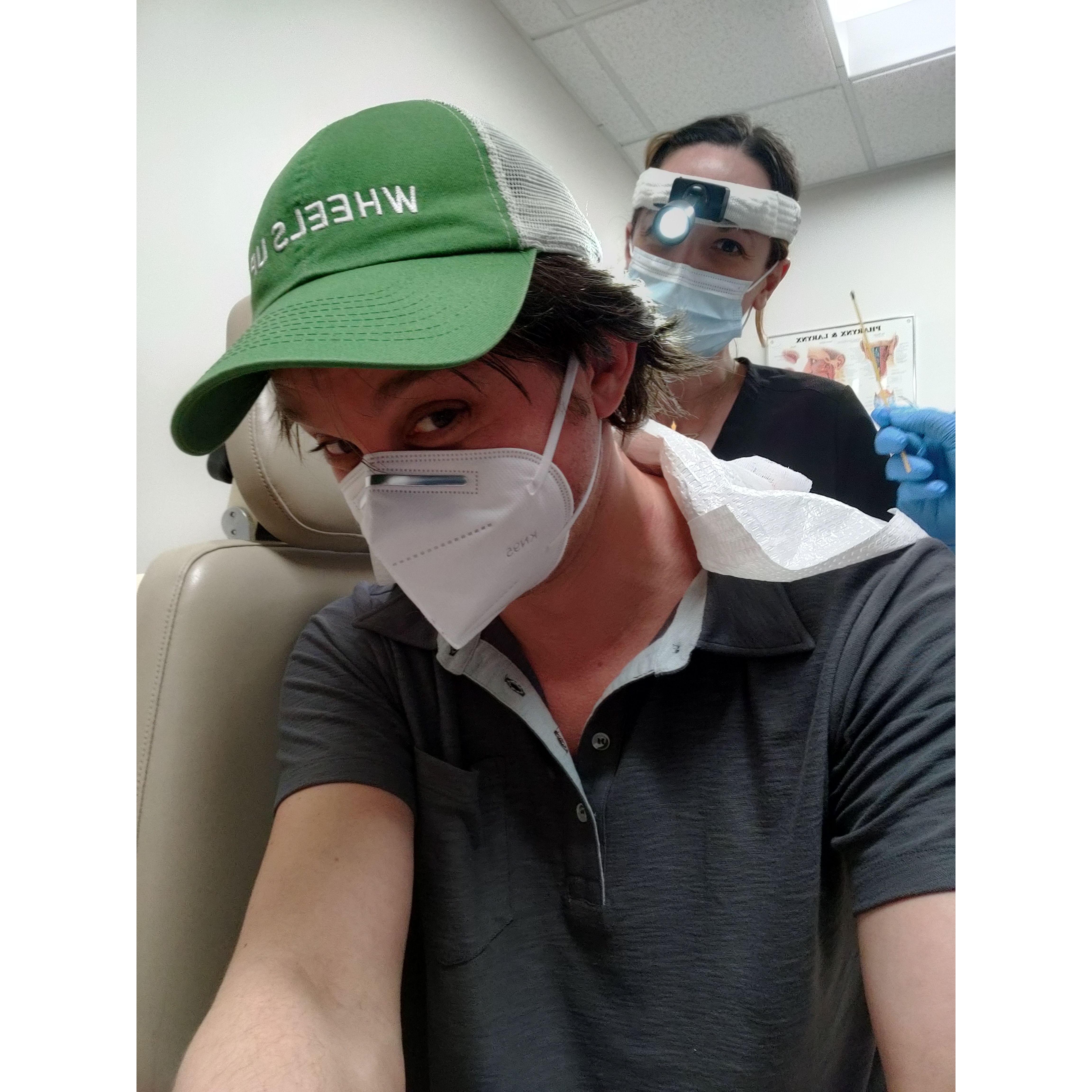 Anne removing a cyst from Paul's neck