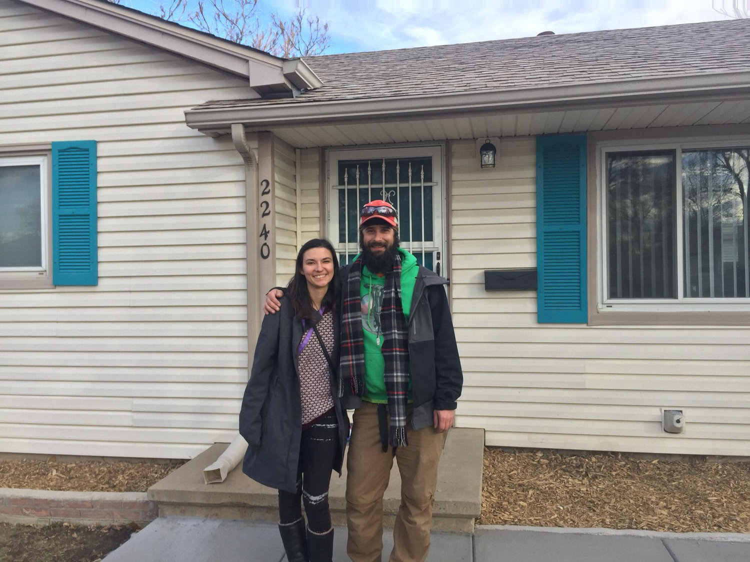 Us in front of our new home when we bought it in 2018!