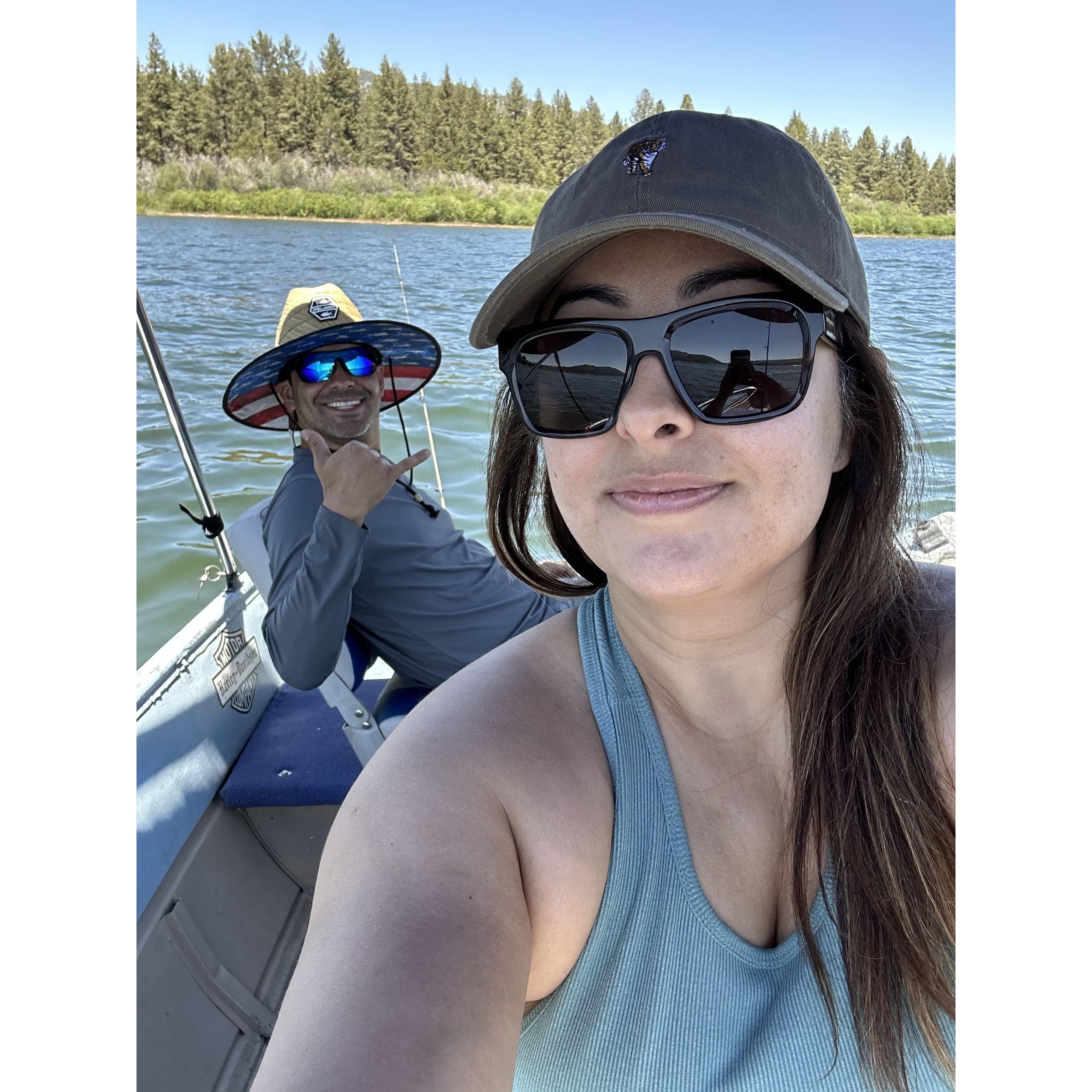 A boy with his boat and a girl with her book
