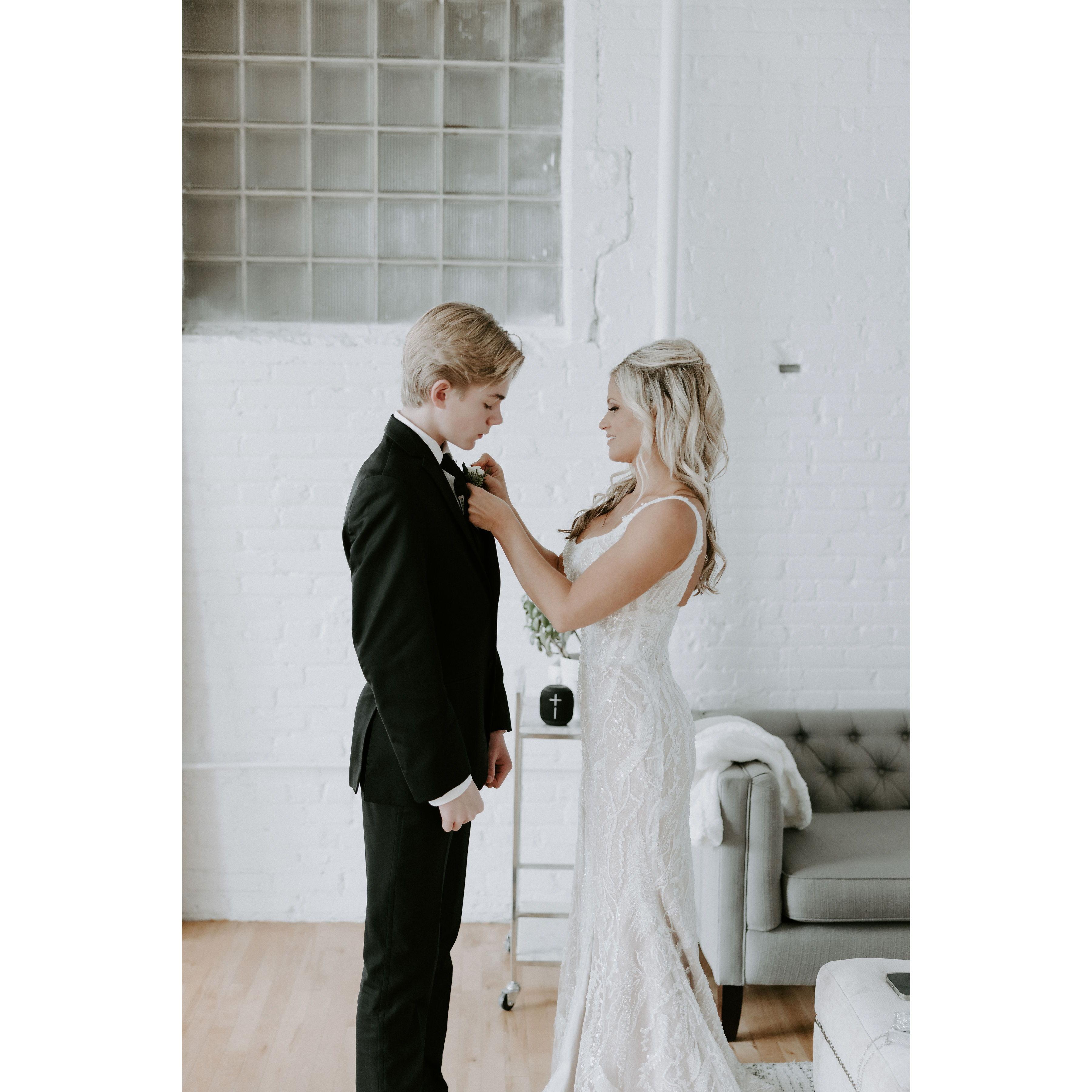 Lindsey putting on Paul's boutonniere