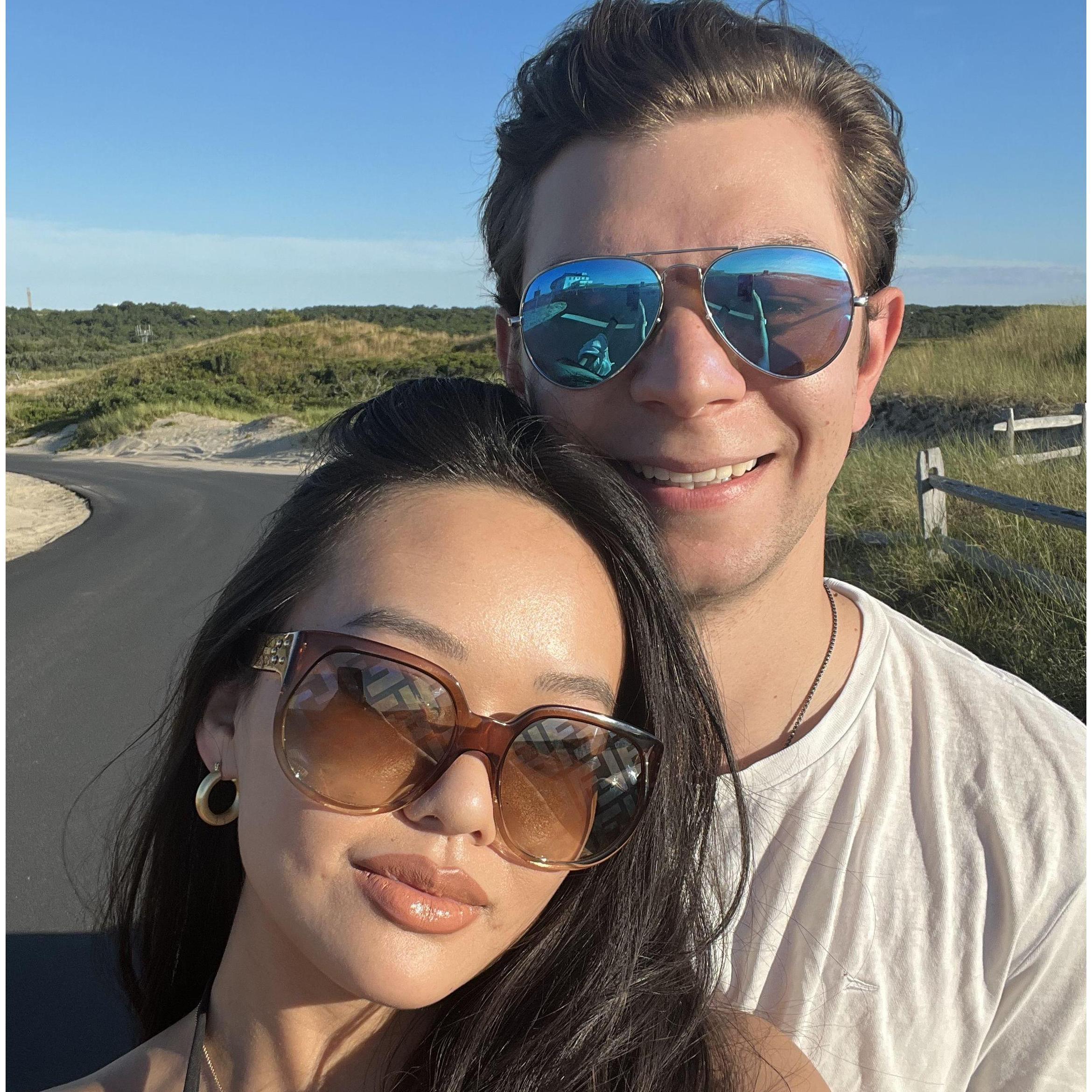 Us at Cape Cod (one of our favorite spots every summer for views, oysters, and Aperol spritz)