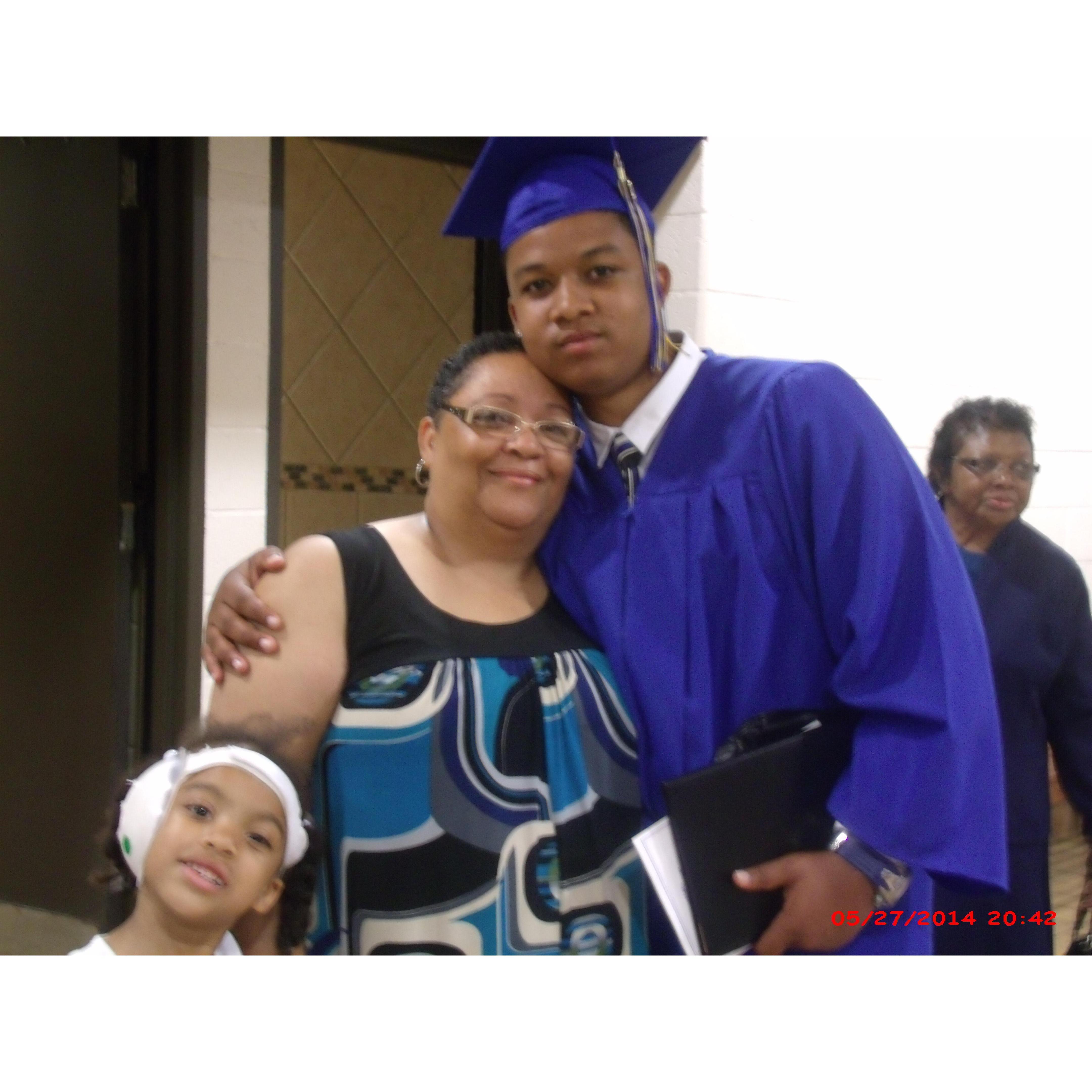 Our son with one Grandmother in the front and one in the back and little sister in tow!!! He is covered!