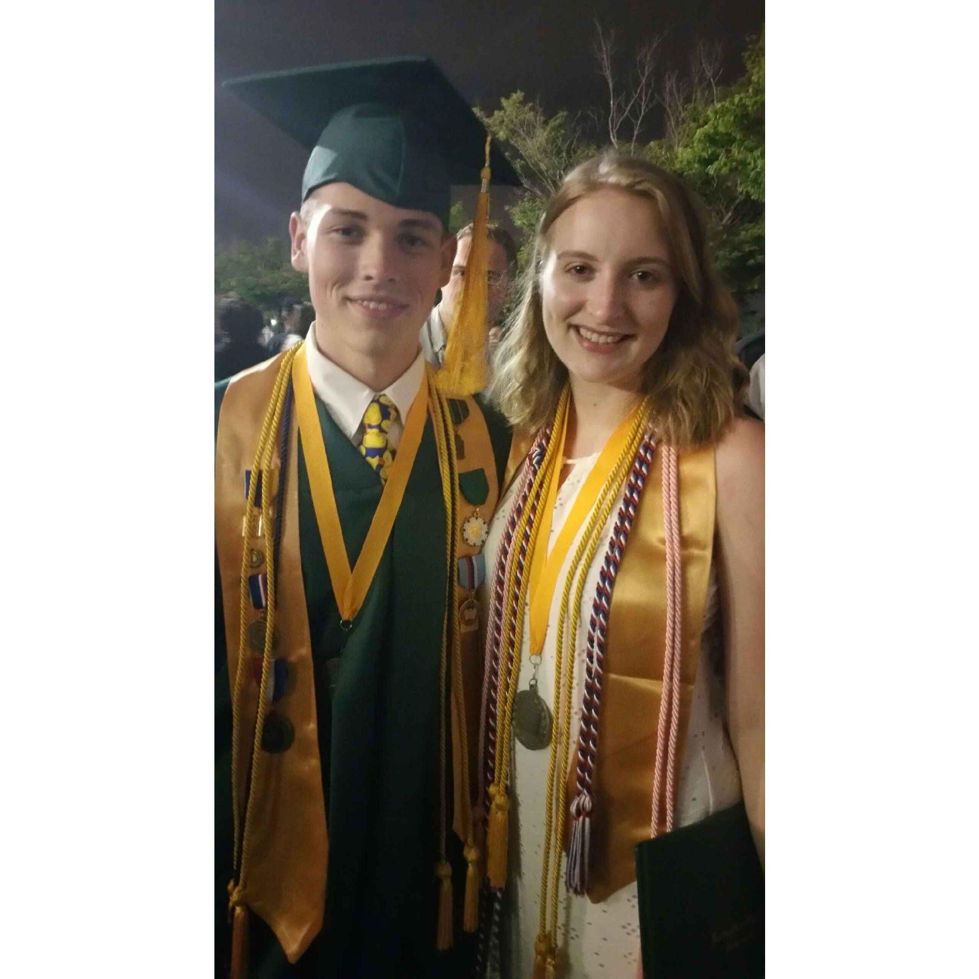 Graduating from high school together. *peep Bradley in the background*