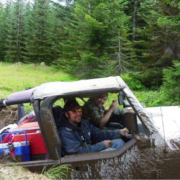 The first time Brandon let Jess wheel the jeep, and she got it very stuck in a giant hole. Great memory!