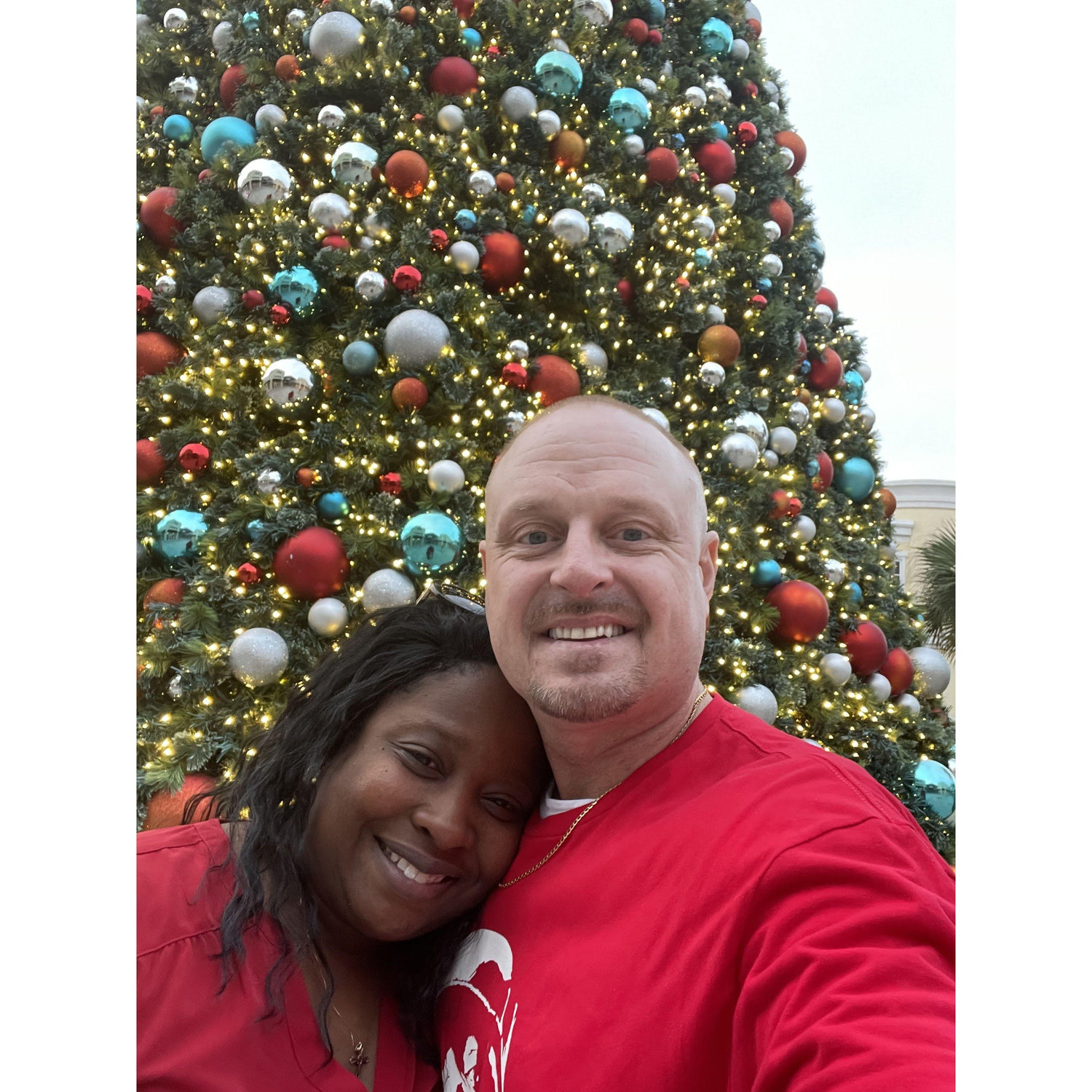 I promise we didn't coordinate our outfits and certainly didn't know this tree was set up in the Charleston Outlets.