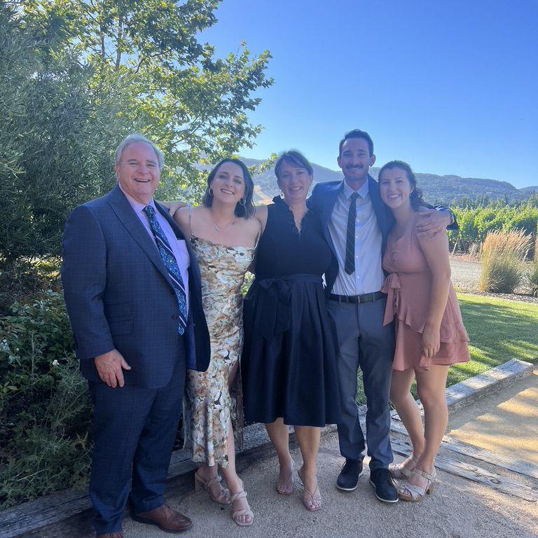 July 2023: Celebrating the marriage of Lauren, sister of Eddie’s Best Man, Bryan, and her husband, Luke. Pictured here are Eddie’s parents and his sister, Emily.