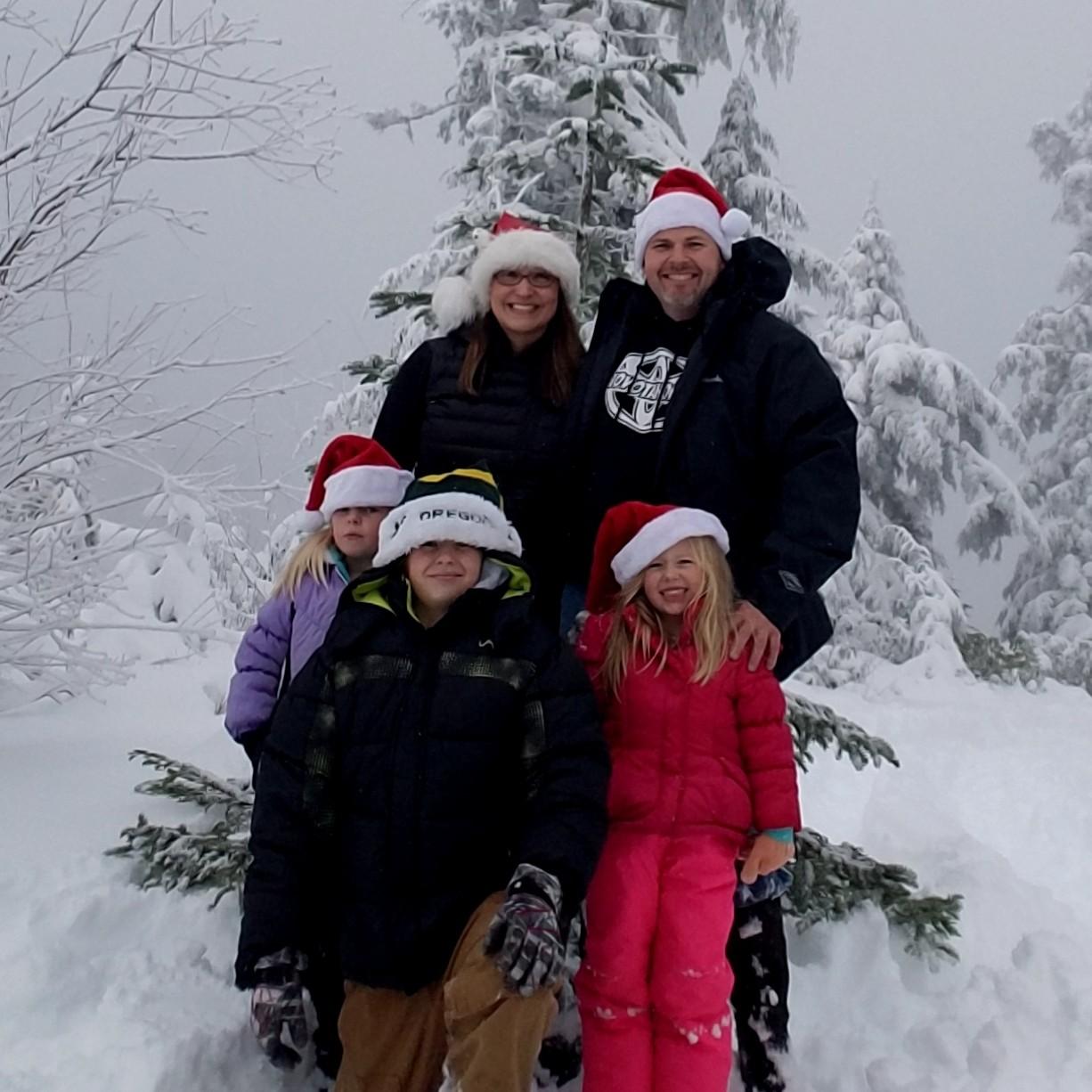 The whole family, standing in front of the Christmas tree we found and brought home to decorate!  (Dec 2017)