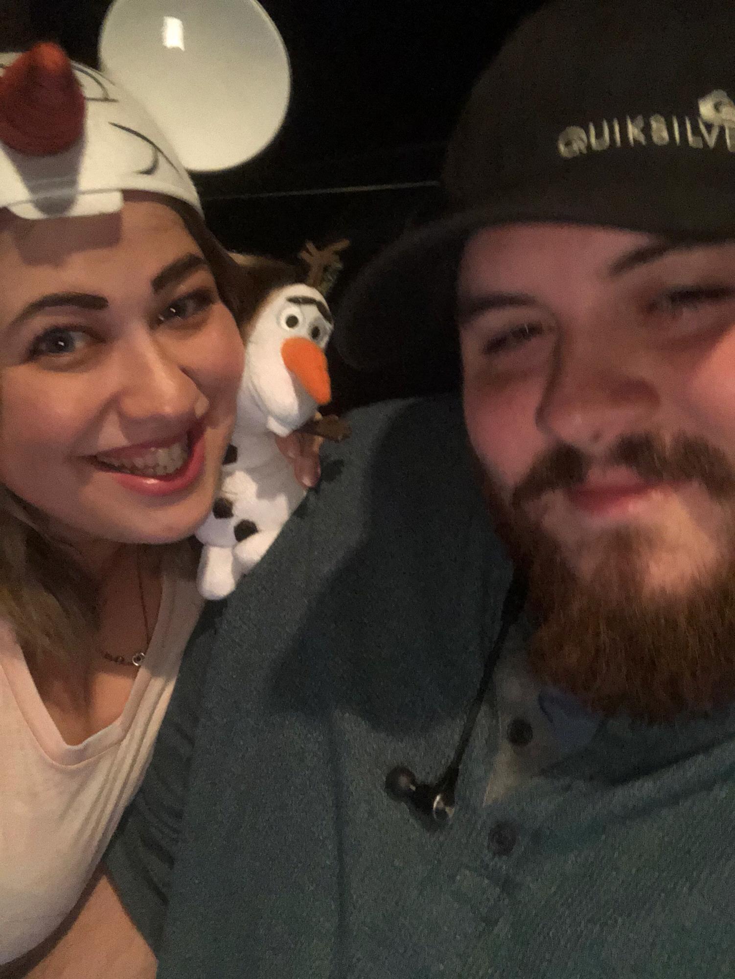 Watching Frozen 2, and the bride showing off her love of Olaf.