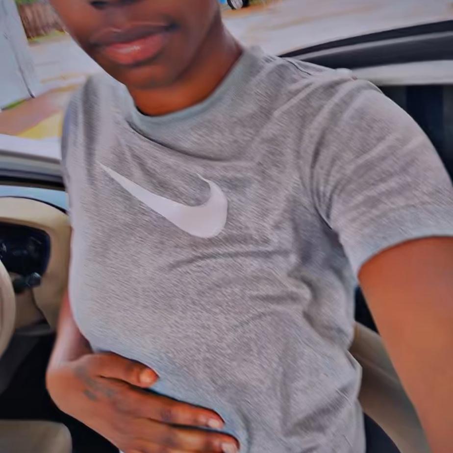 Bae taking pics outside of our old car