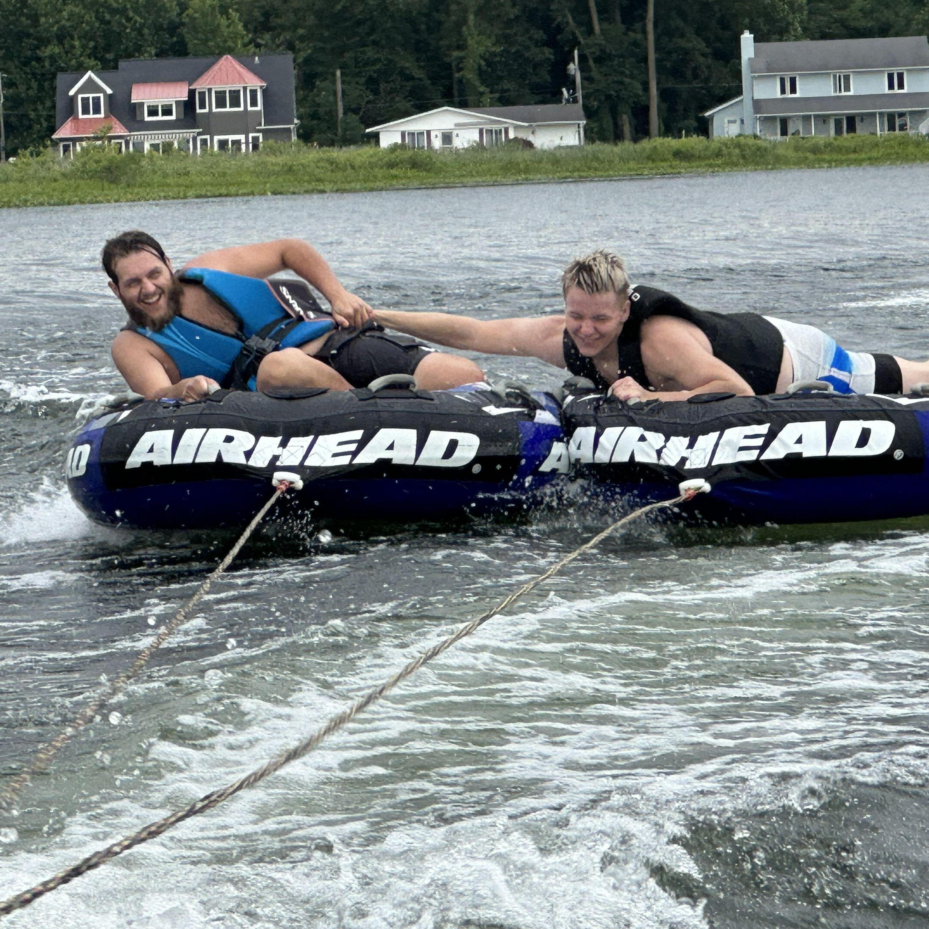 Ethan and Athen tubing at the lake