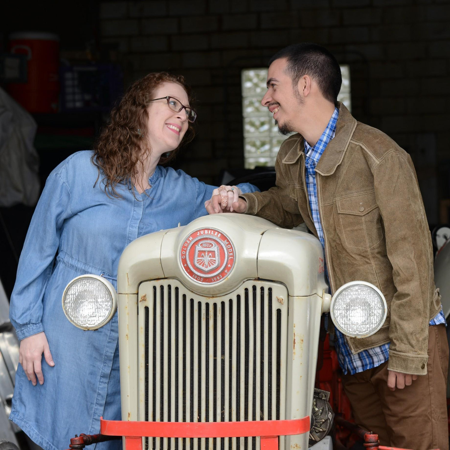 Neither of us own a tractor or drive one regularly - but the tractor was in one of the barns at Tikkun Farm. The tractor seemed a fun thing to include in our photos.