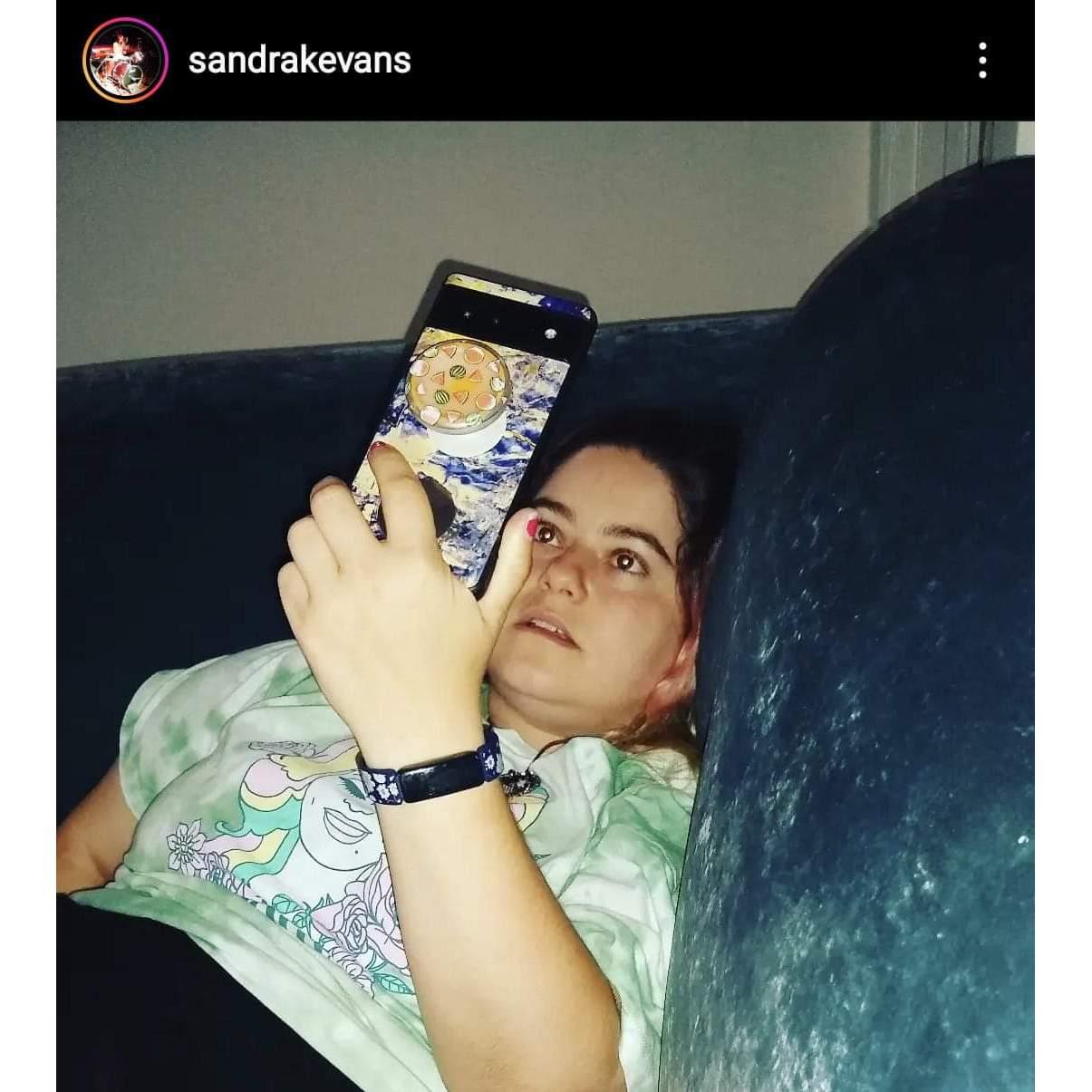 Shannon video chatting with Troy while visiting her bestie Sandra in California.
