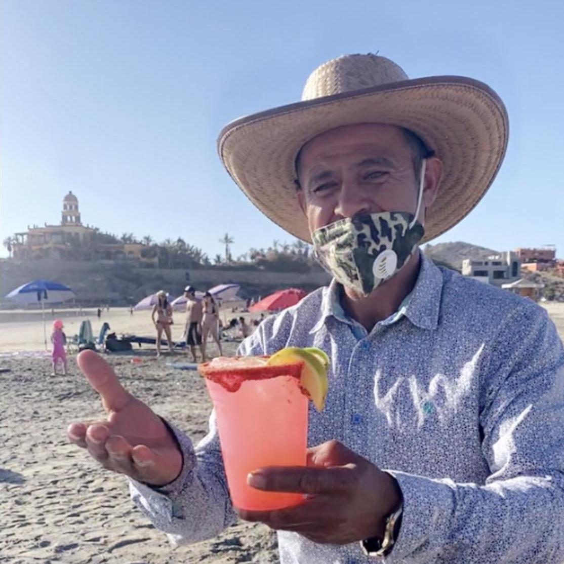 One of our favorite locals, Charlie! Makes the best on-beach-cocktails with his wagon + cooler + good tunes+ smiles!