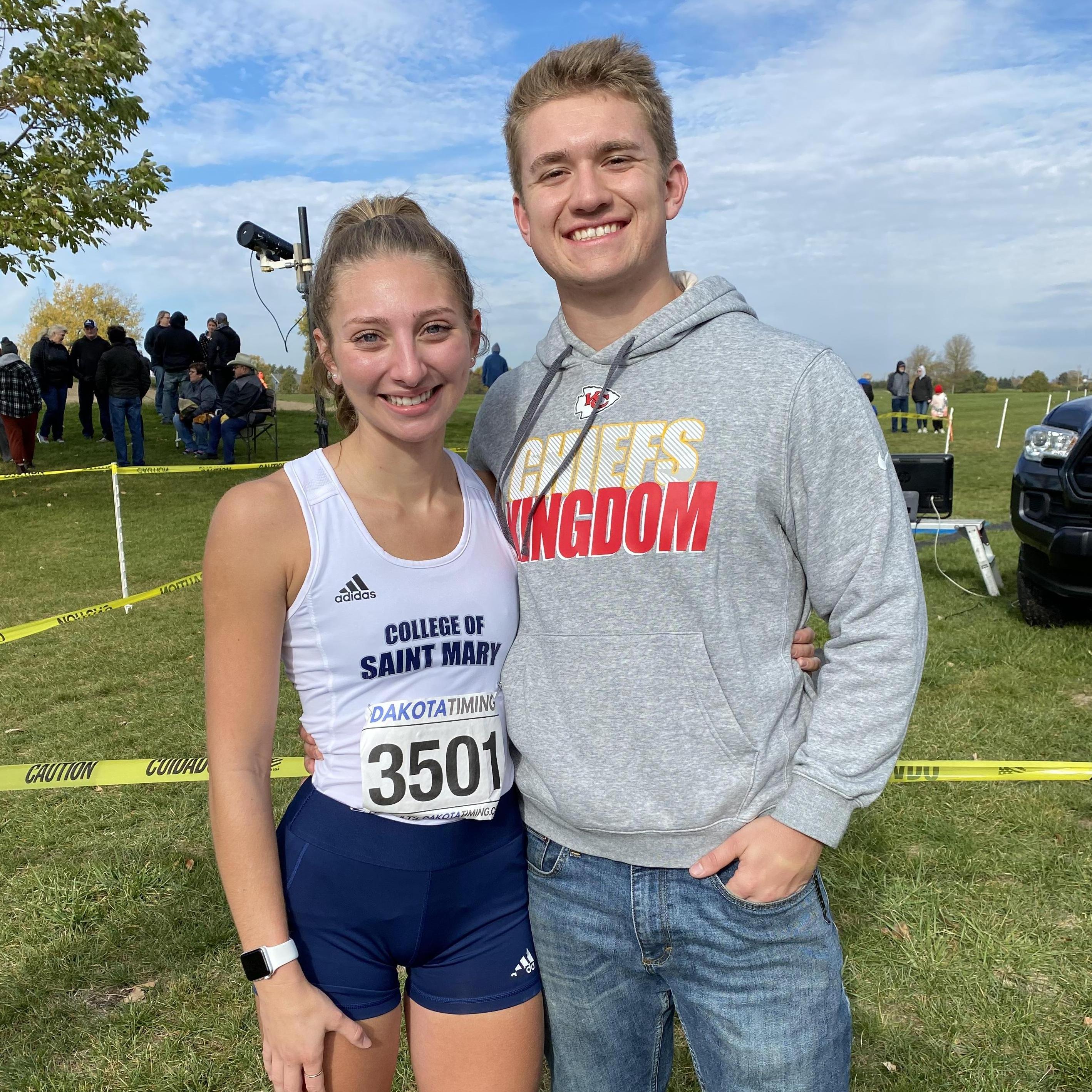 Aaron supporting Aly at one of her cross country meets