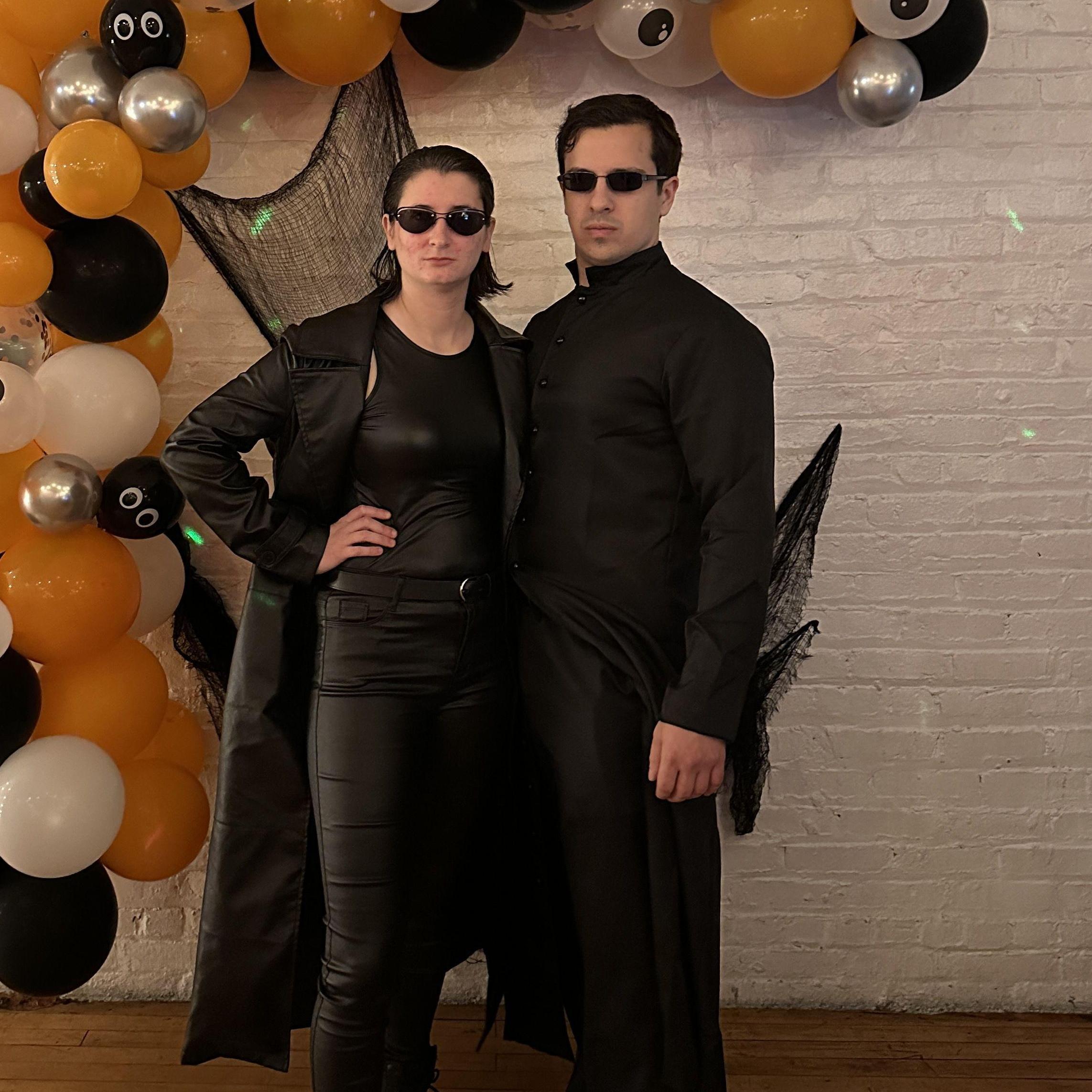 Why? Why do you do it? Why do you wear these ridiculous outfits?
Because we choose to.
Hala is a good sport and she makes a good Trinity in our Matrix Halloween getup.