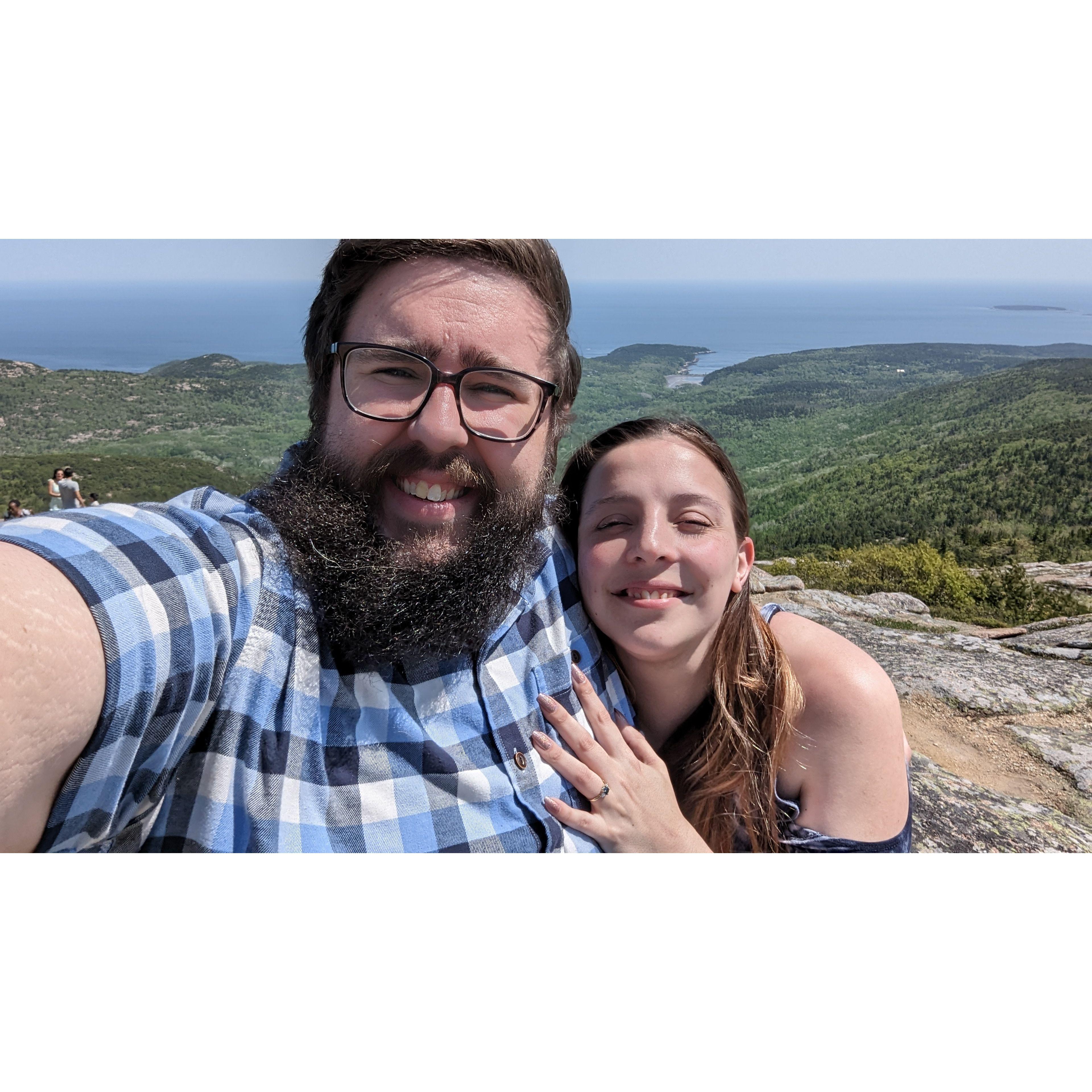 It was a bit windy, but she said yes anyway! At the top of Cadillac Mountain at Acadia national park May 28th 2023.