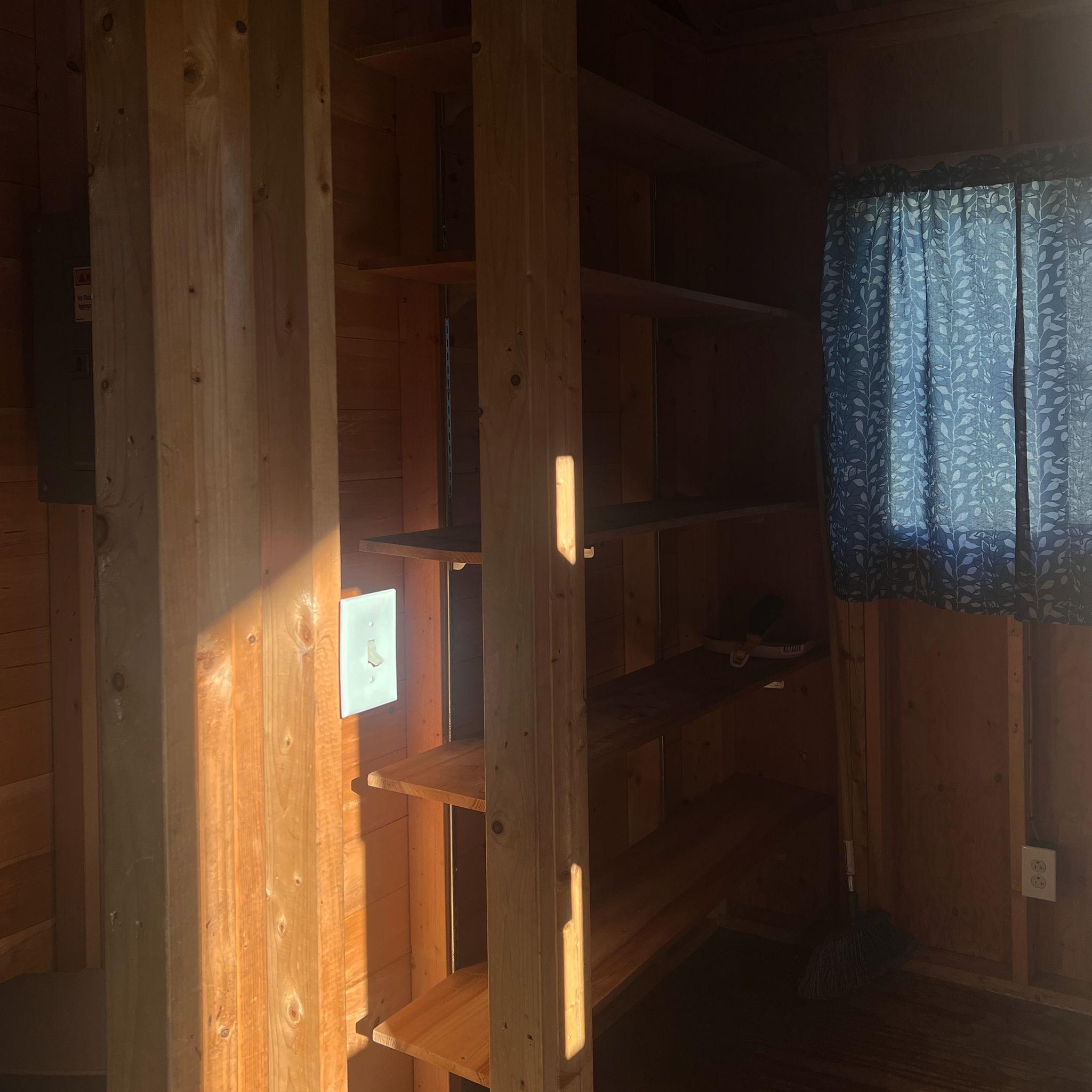 Camp Neringa cabin interior. Storage & coat rack area.