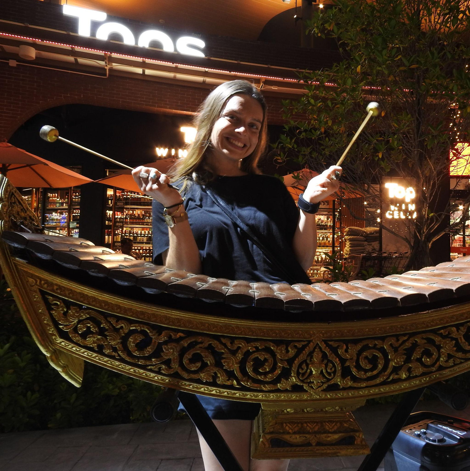 Playing the traditional xylophone