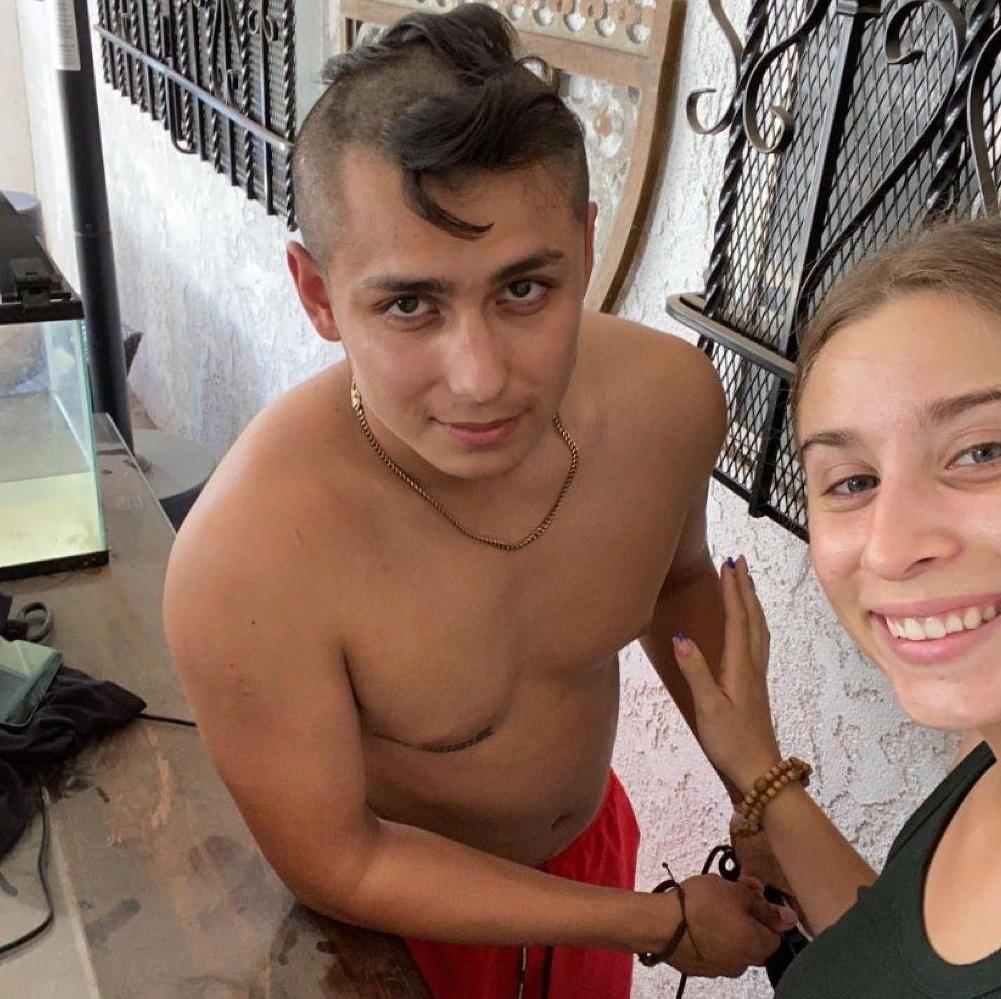 ari cutting isaac's hair for the academy