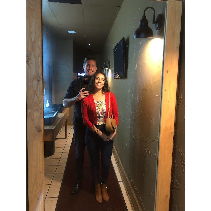 Mirror selfie at our favorite restaurant. (April 2023)  Can't wait to have y'all try their food on our wedding day!