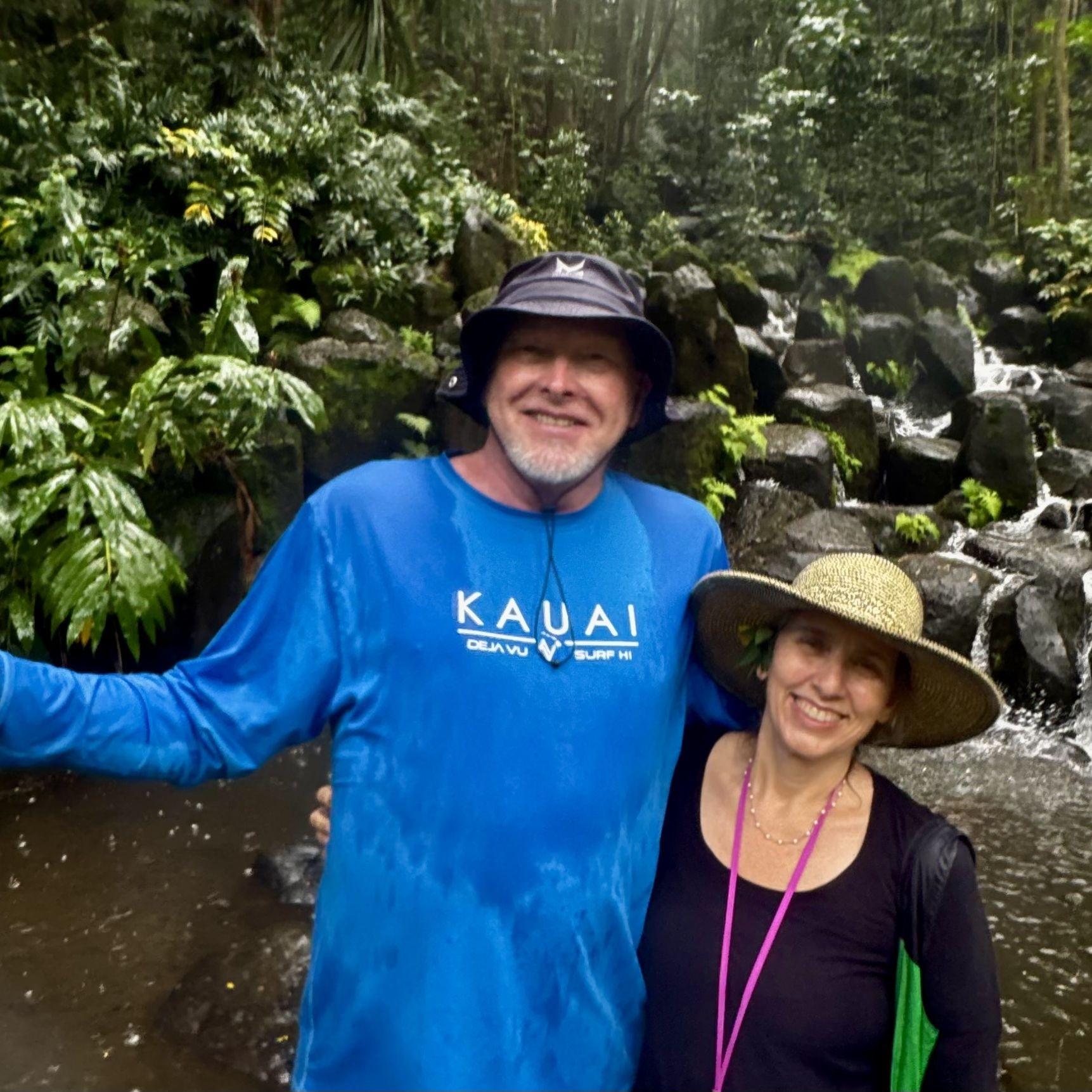 Crossing rivers together in Kauai.