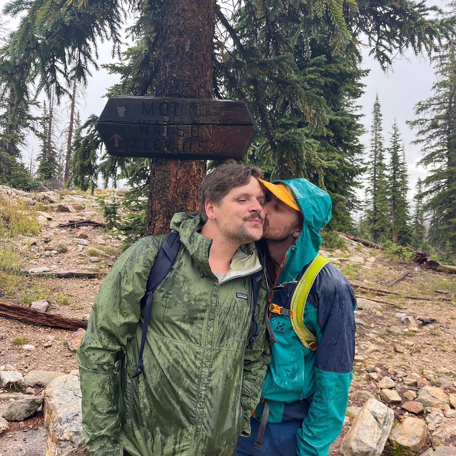 Taking a photo by this sign to Mt Watson in the Uintas has become our tradition since our third date, we go every summer even in the cold rain
